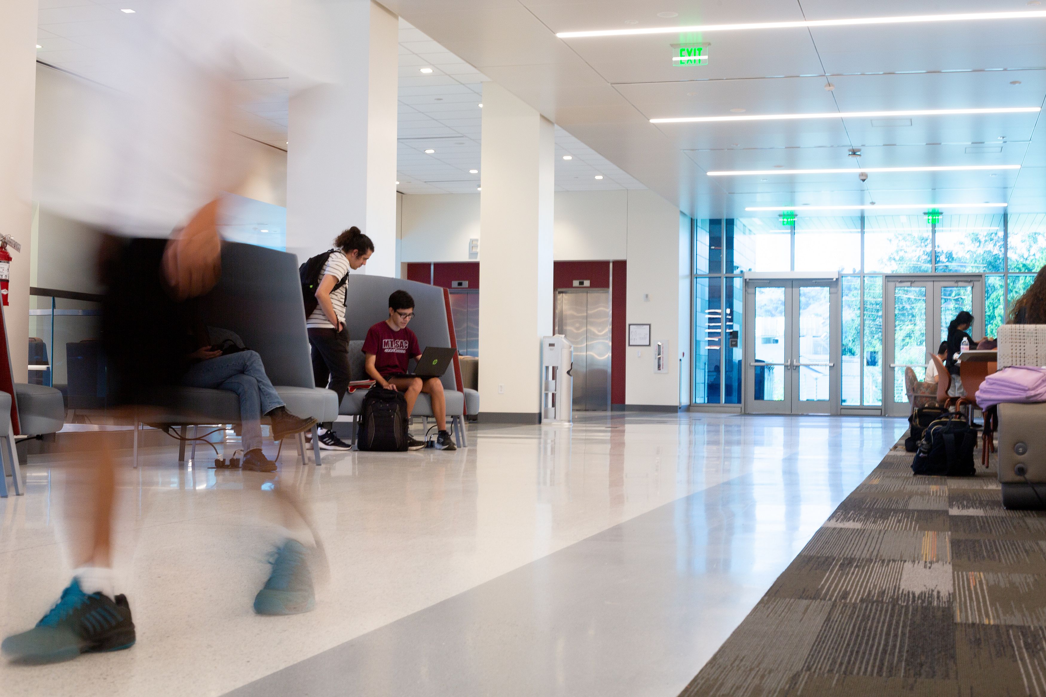 Eric Natividad talks to a classmate inside the student center at Mt. San Antonio College.