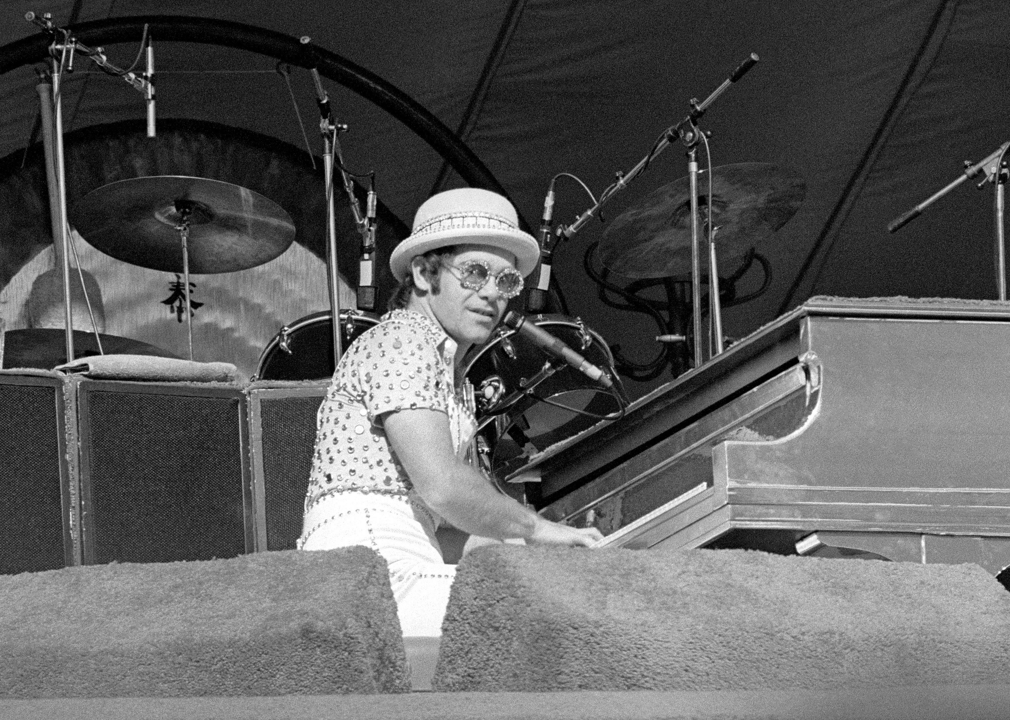 Elton John performs on stage during the West of the Rockies tour.