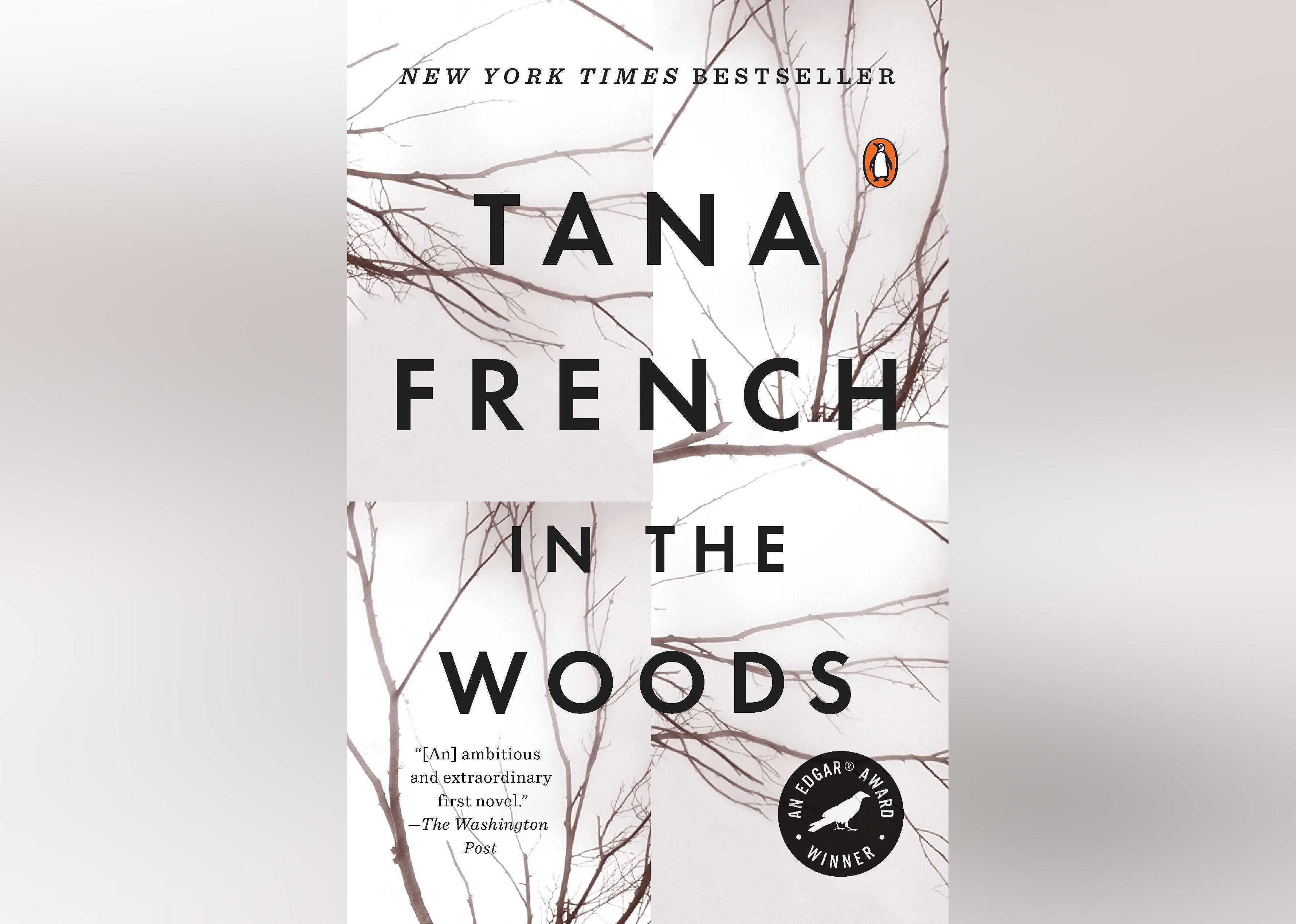 The sepia-toned cover features bare tree branches. 