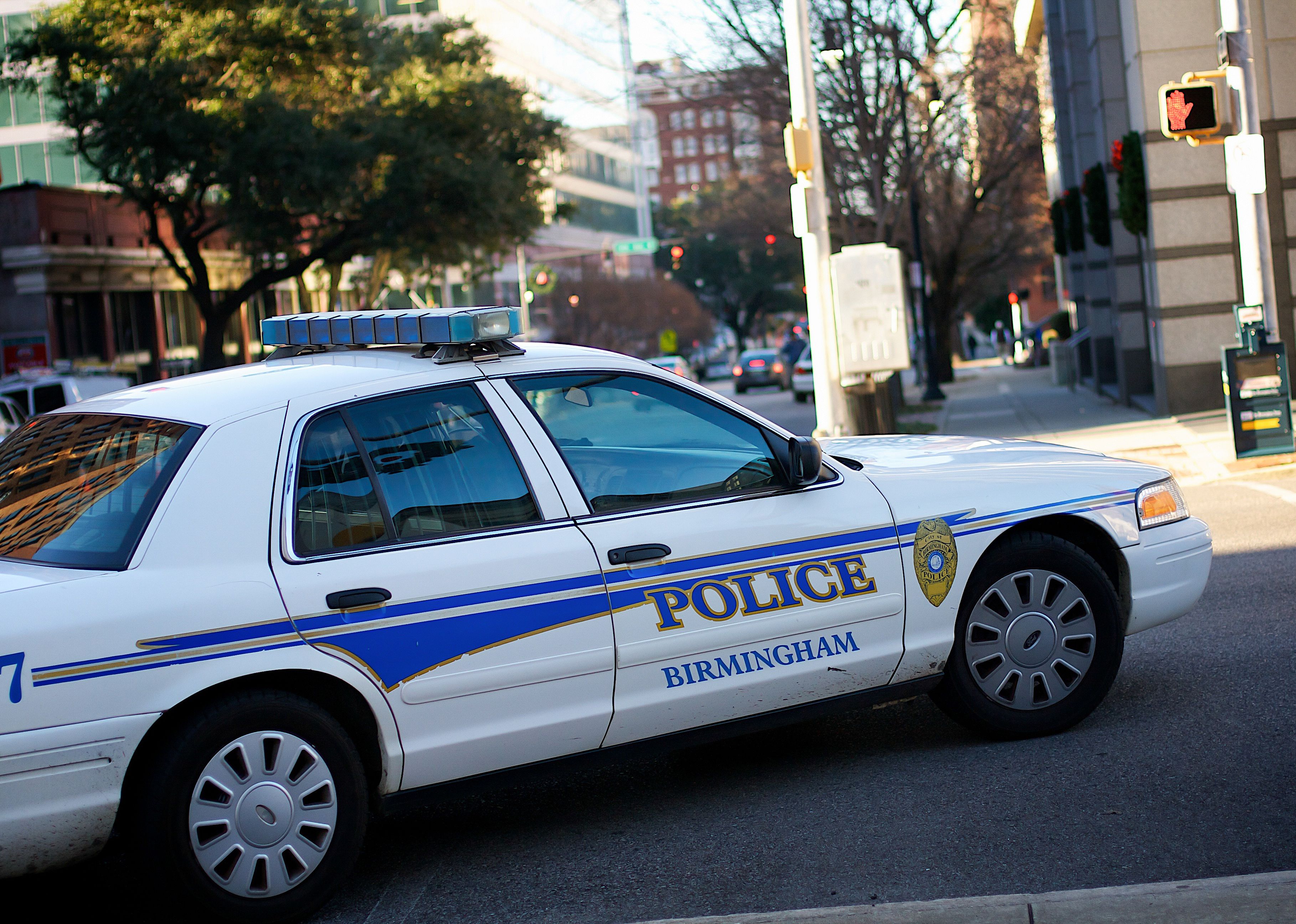 Police car turning a corner in Birmingham.