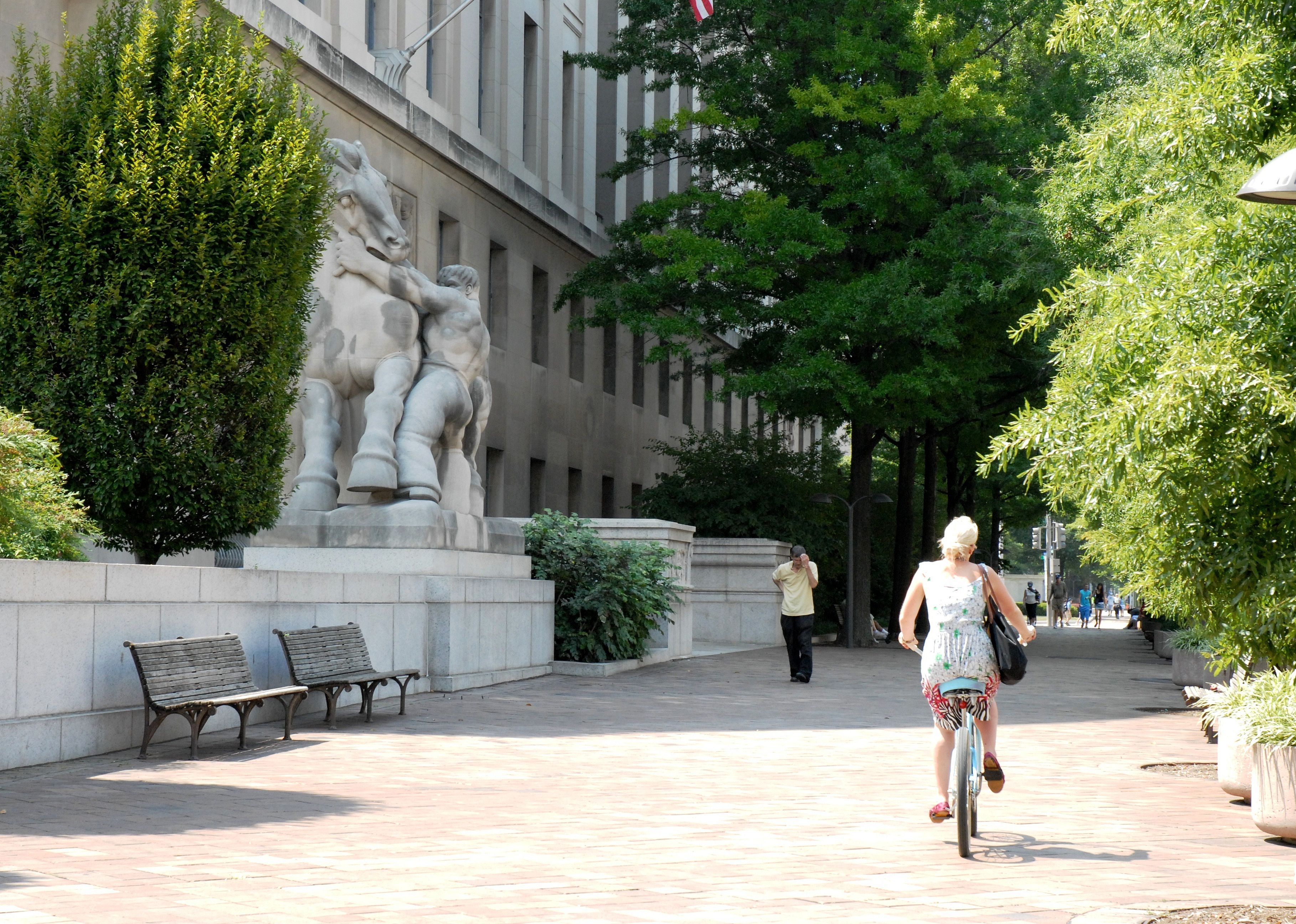 Woman in dress riding bike in Washington D.C.