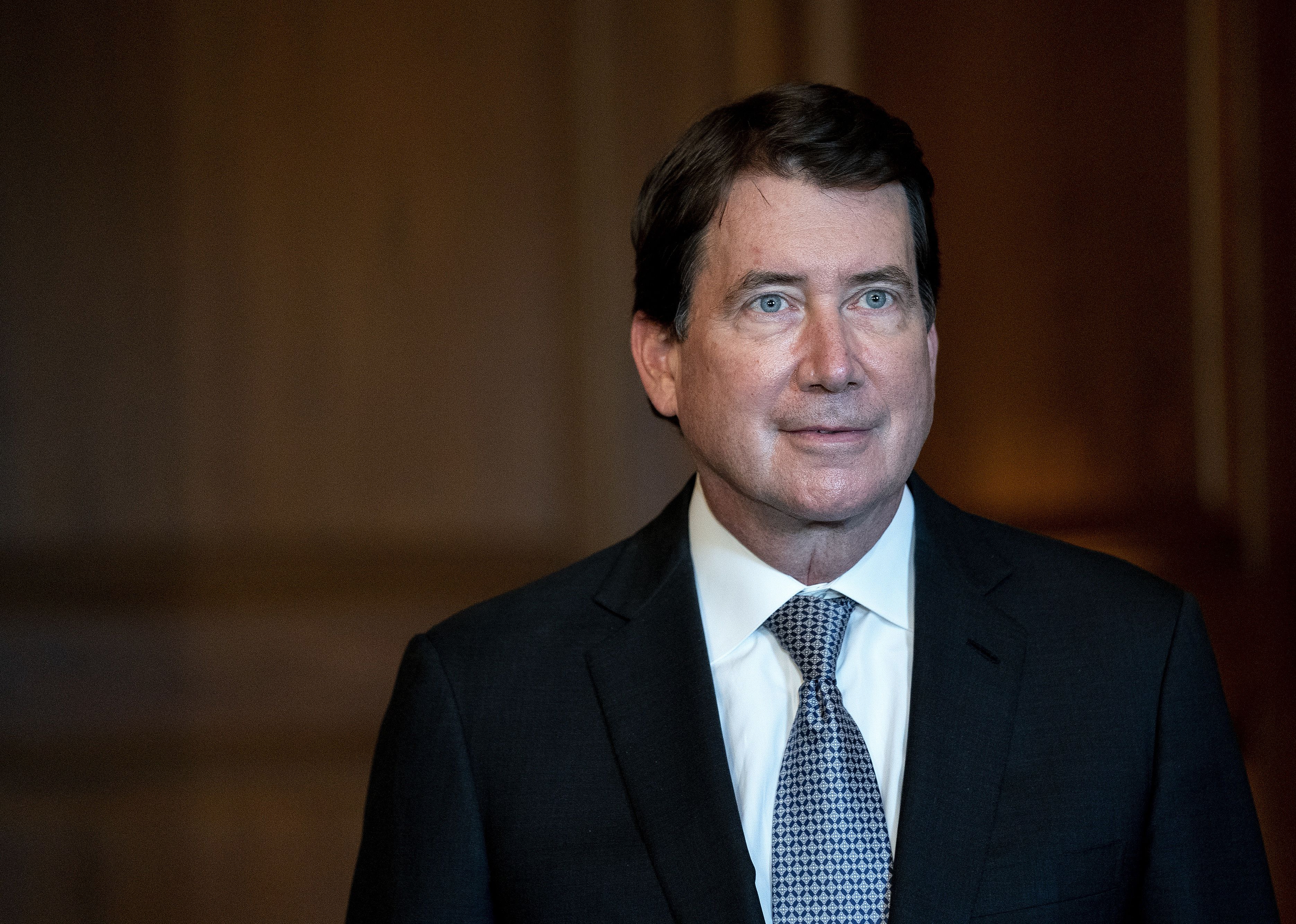 William Hagerty in a dark suit.