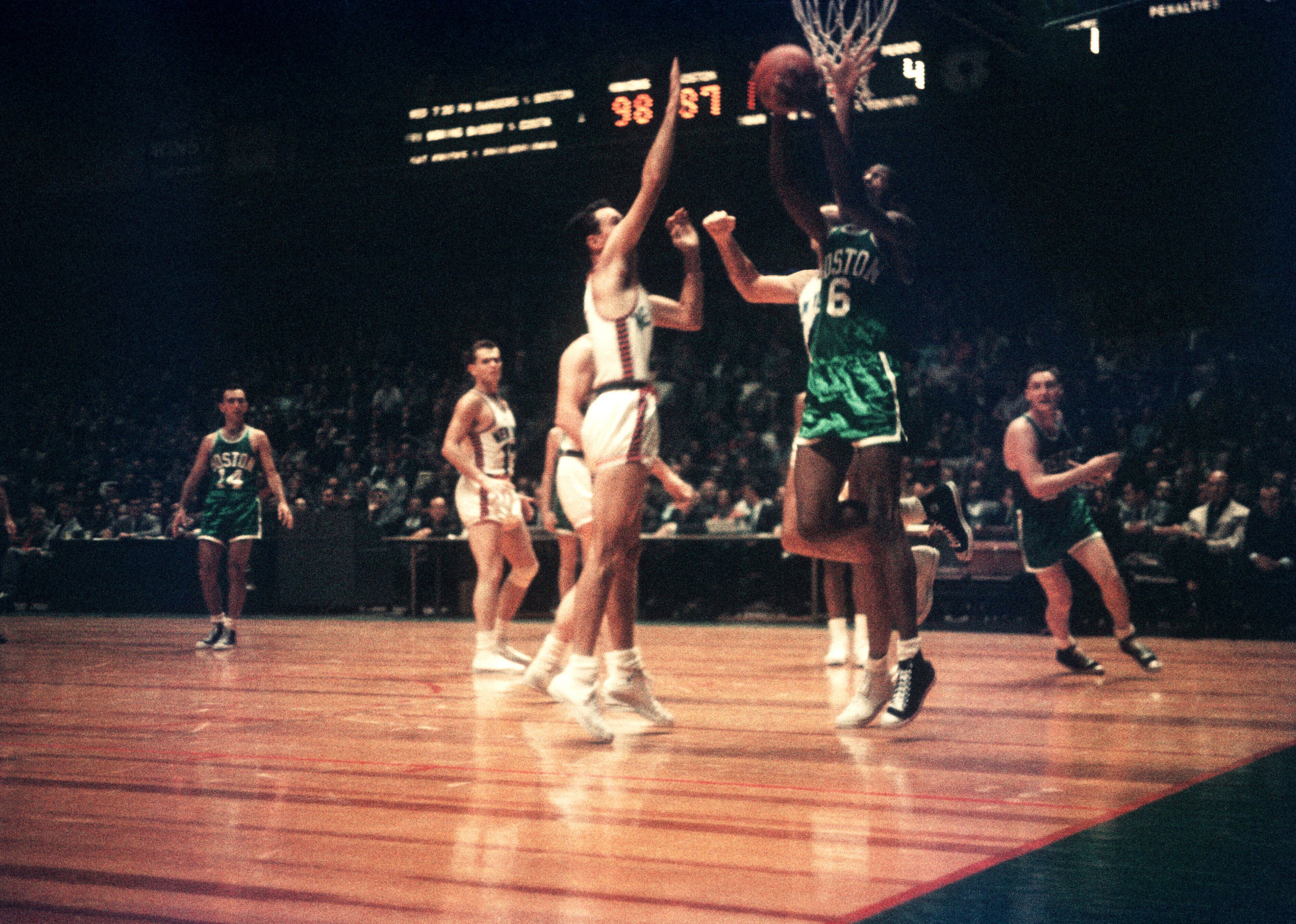 Bill Russell goes for a lay-up