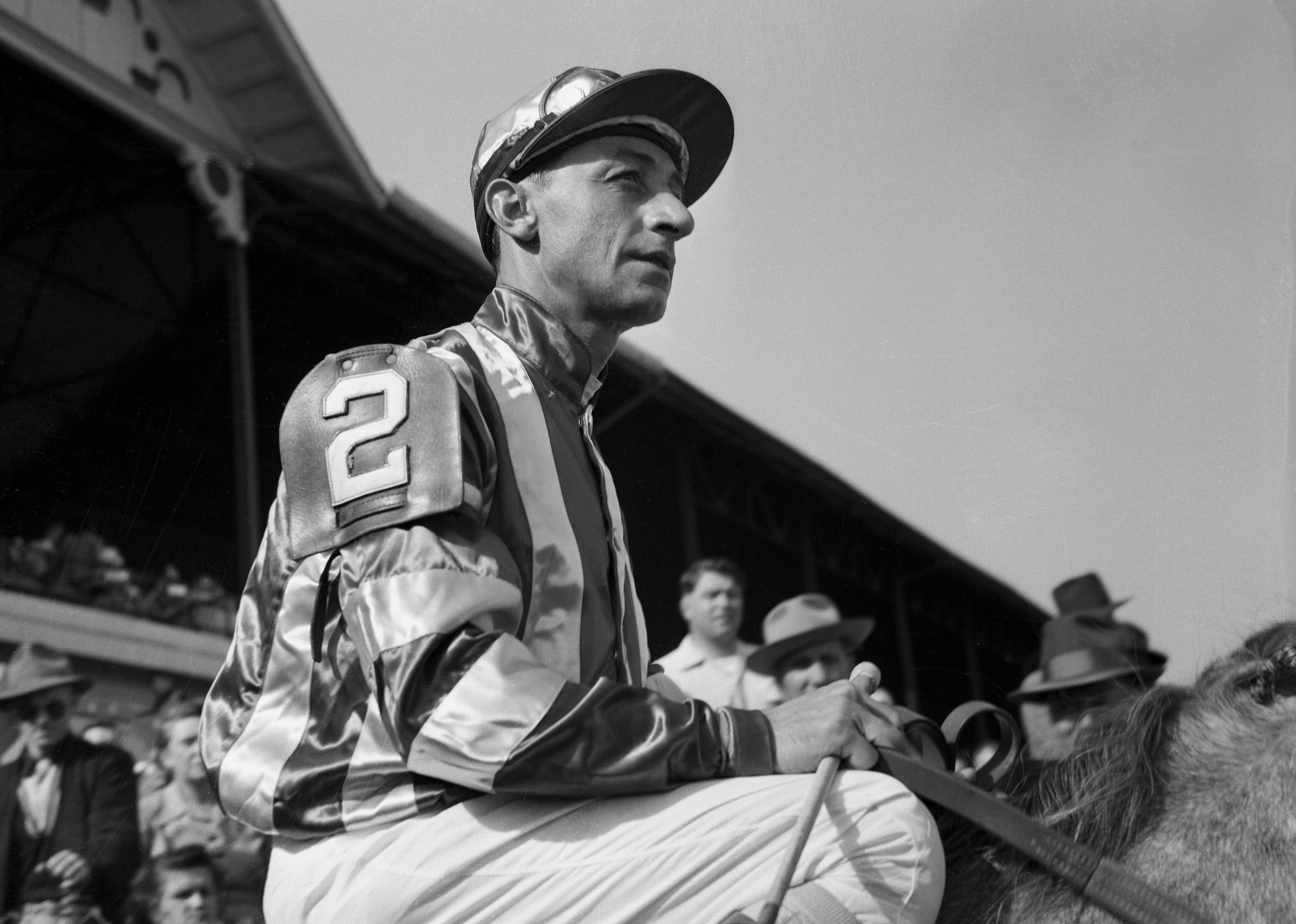 Eddie Arcaro atop a horse before the derby