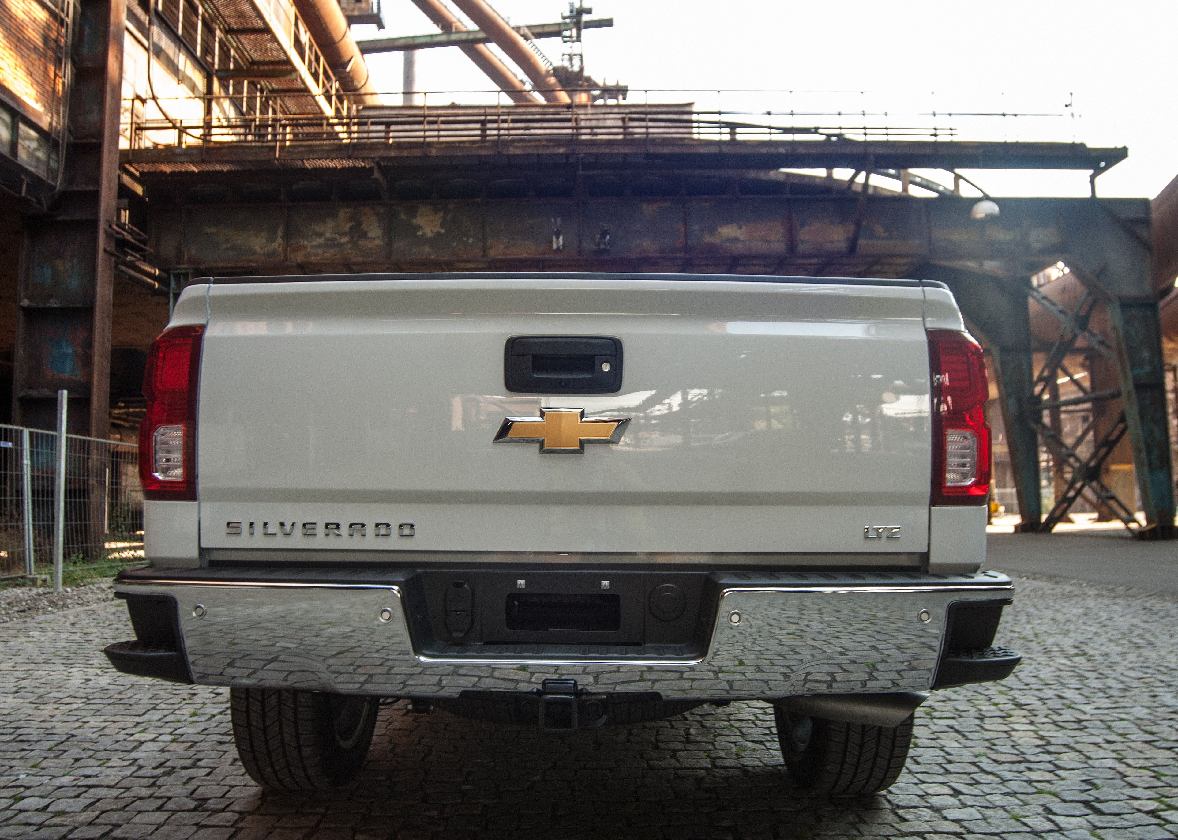 White Chevrolet Silverado 1500 Light Duty Truck.