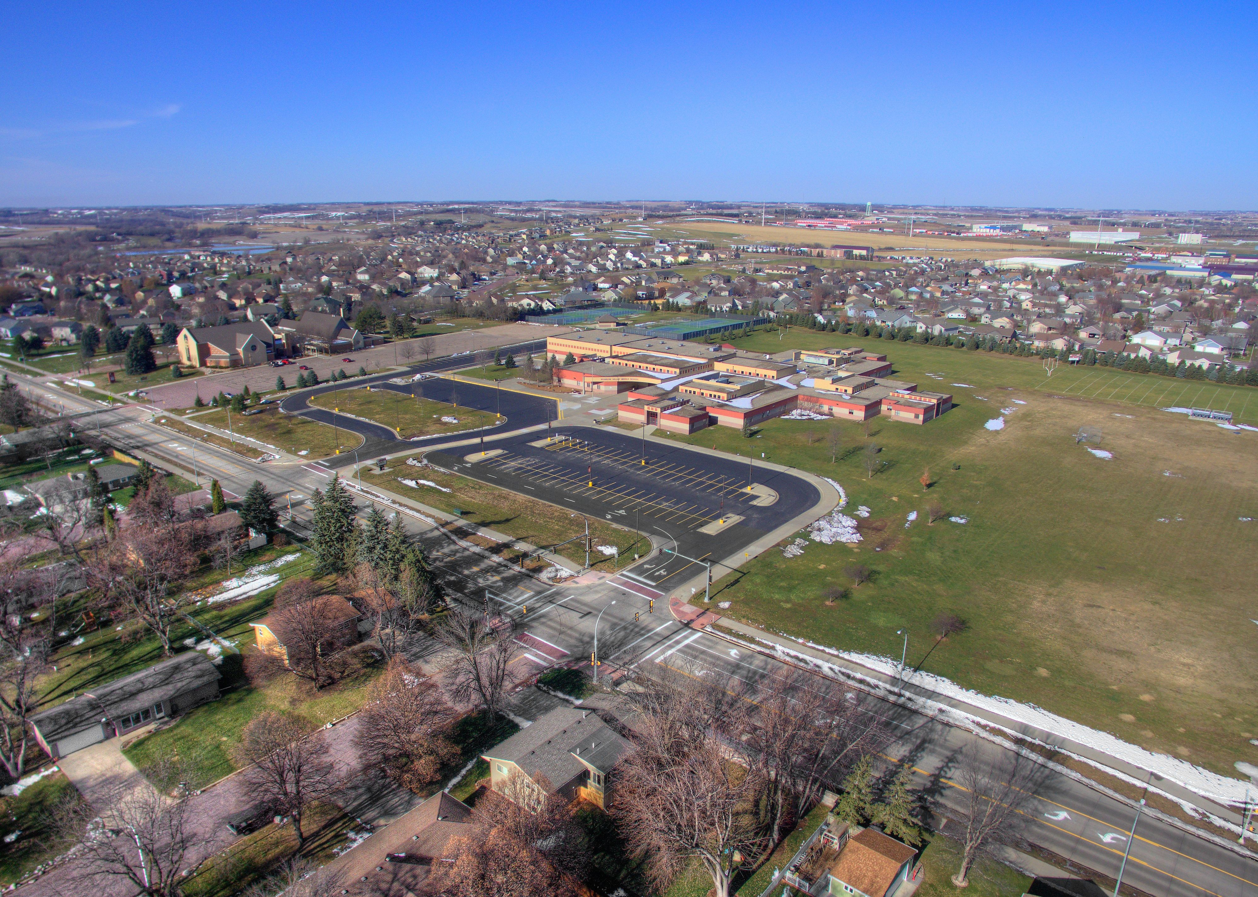 Aerial view of homes and school in late winter.
