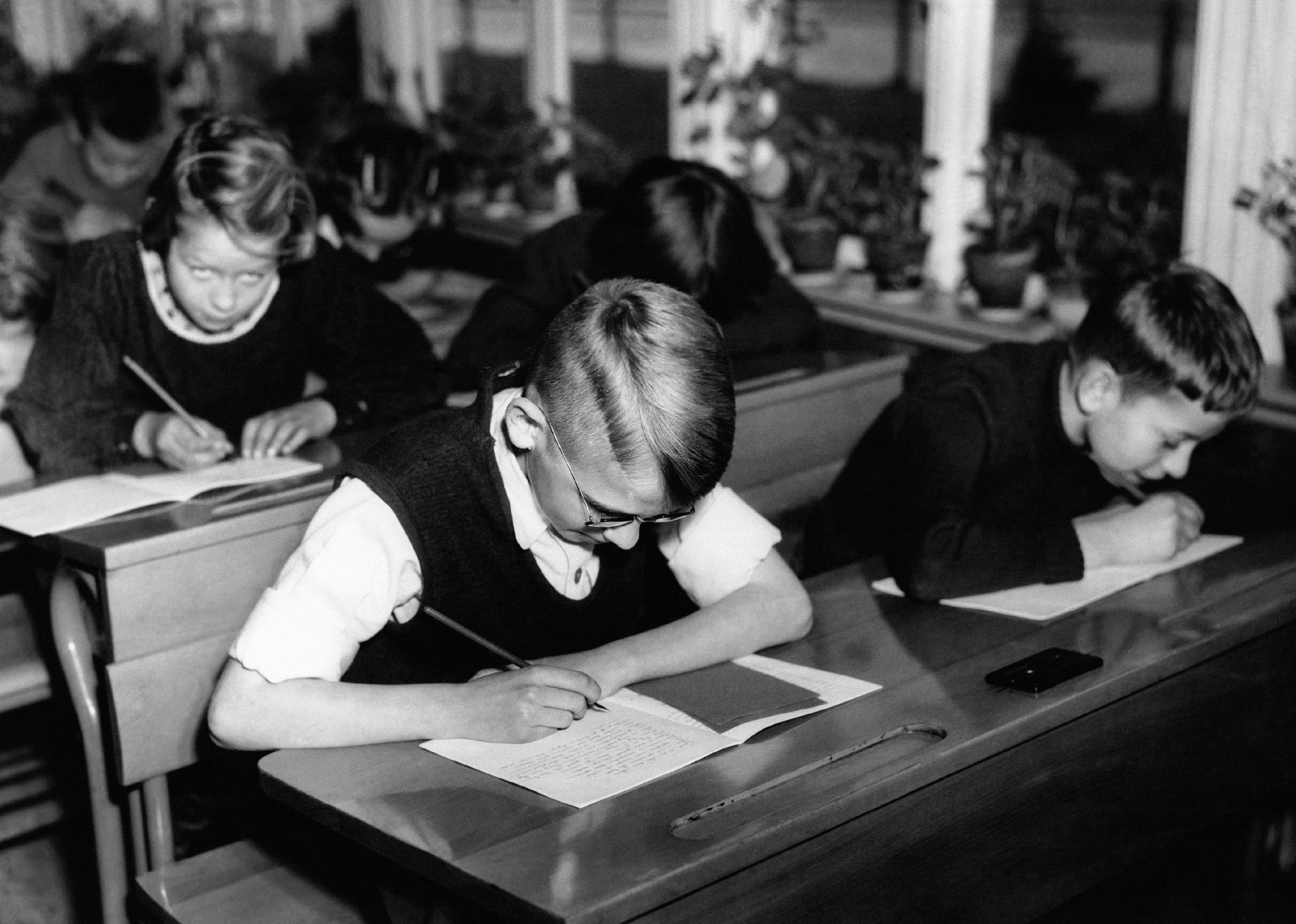 1855-1861: Written examination mandates become common