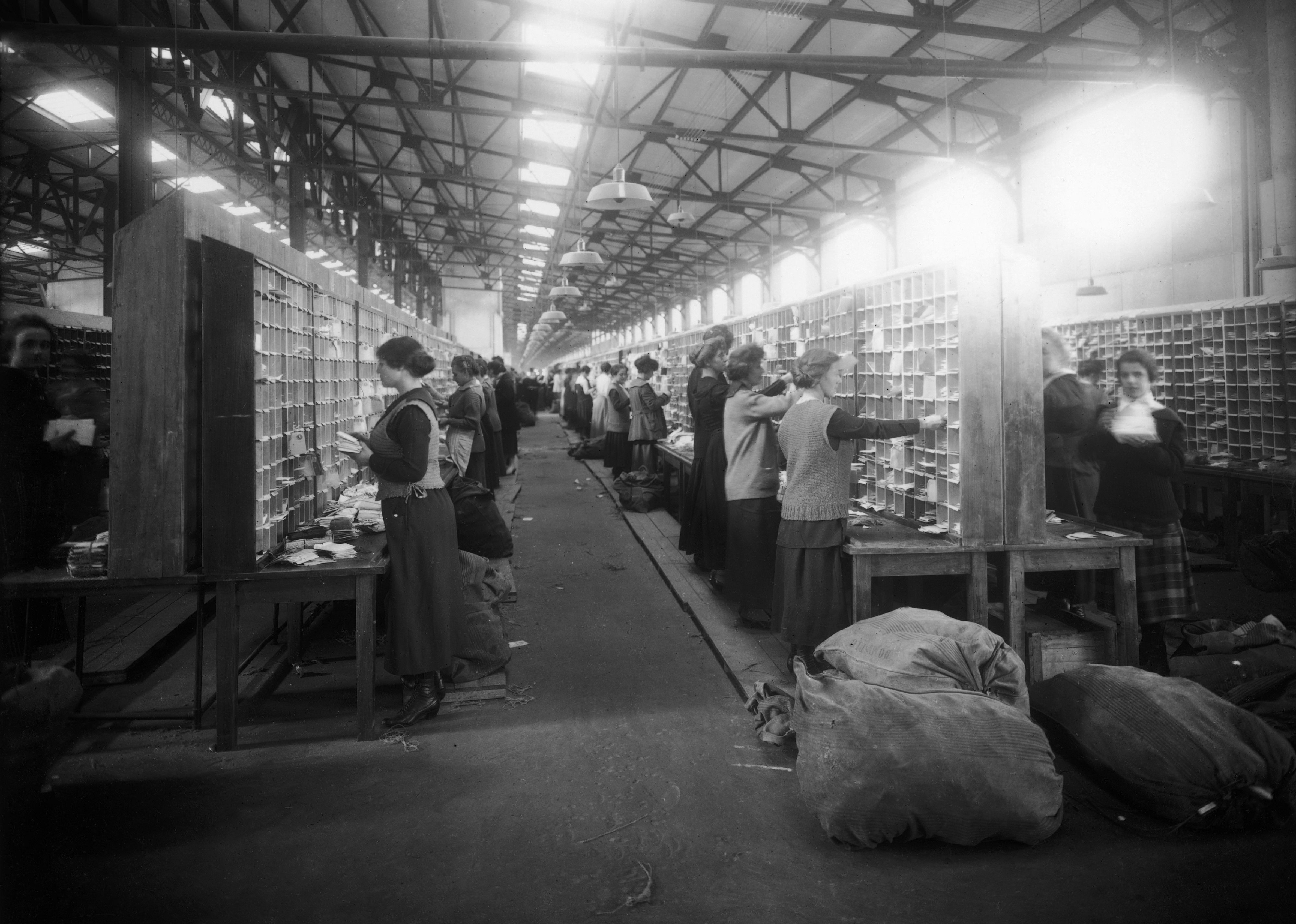 Women postal workers at a sorting office, circa 1920