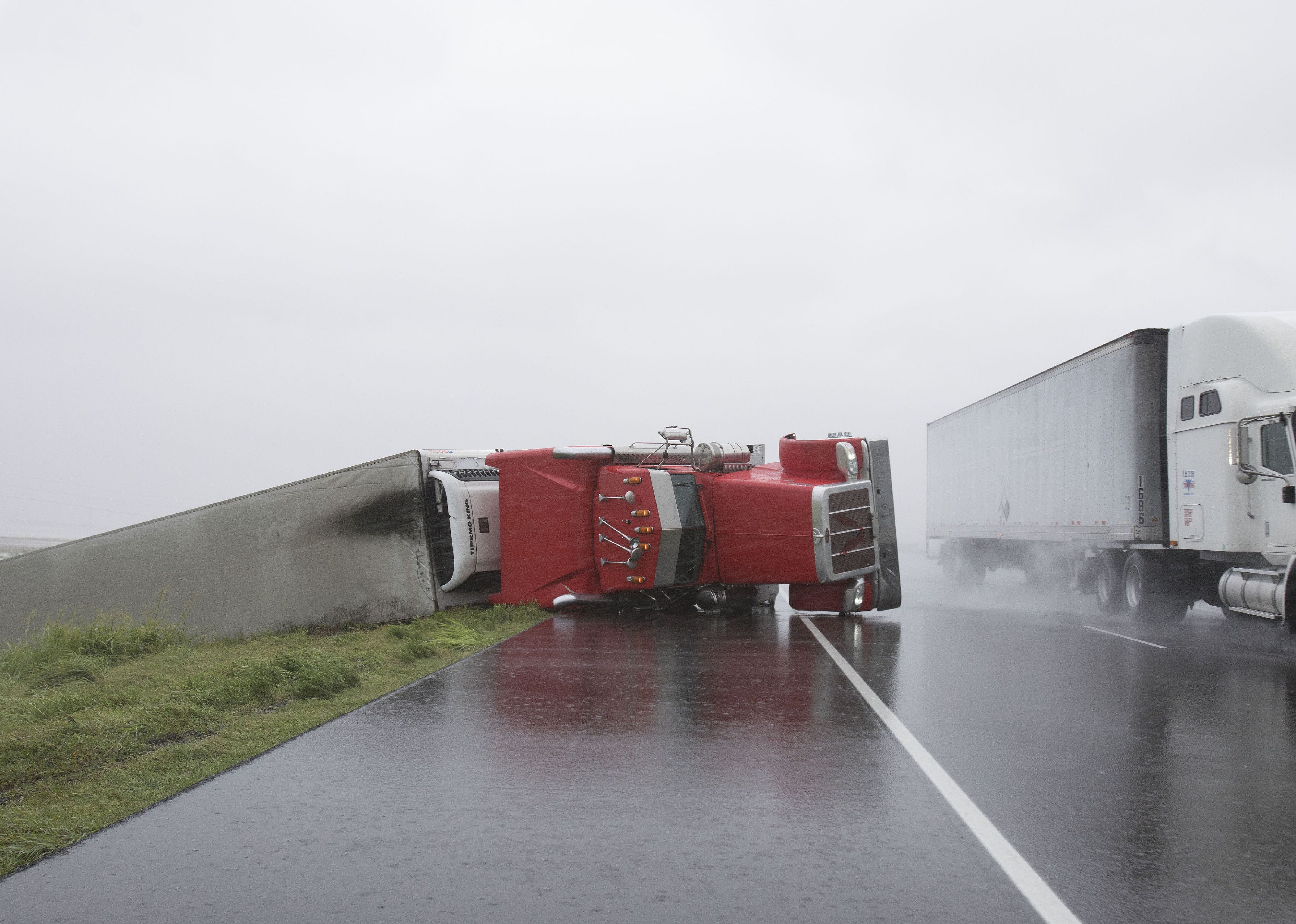 A big rig lies on it's side on Hwy 59 near Edna, Texas
