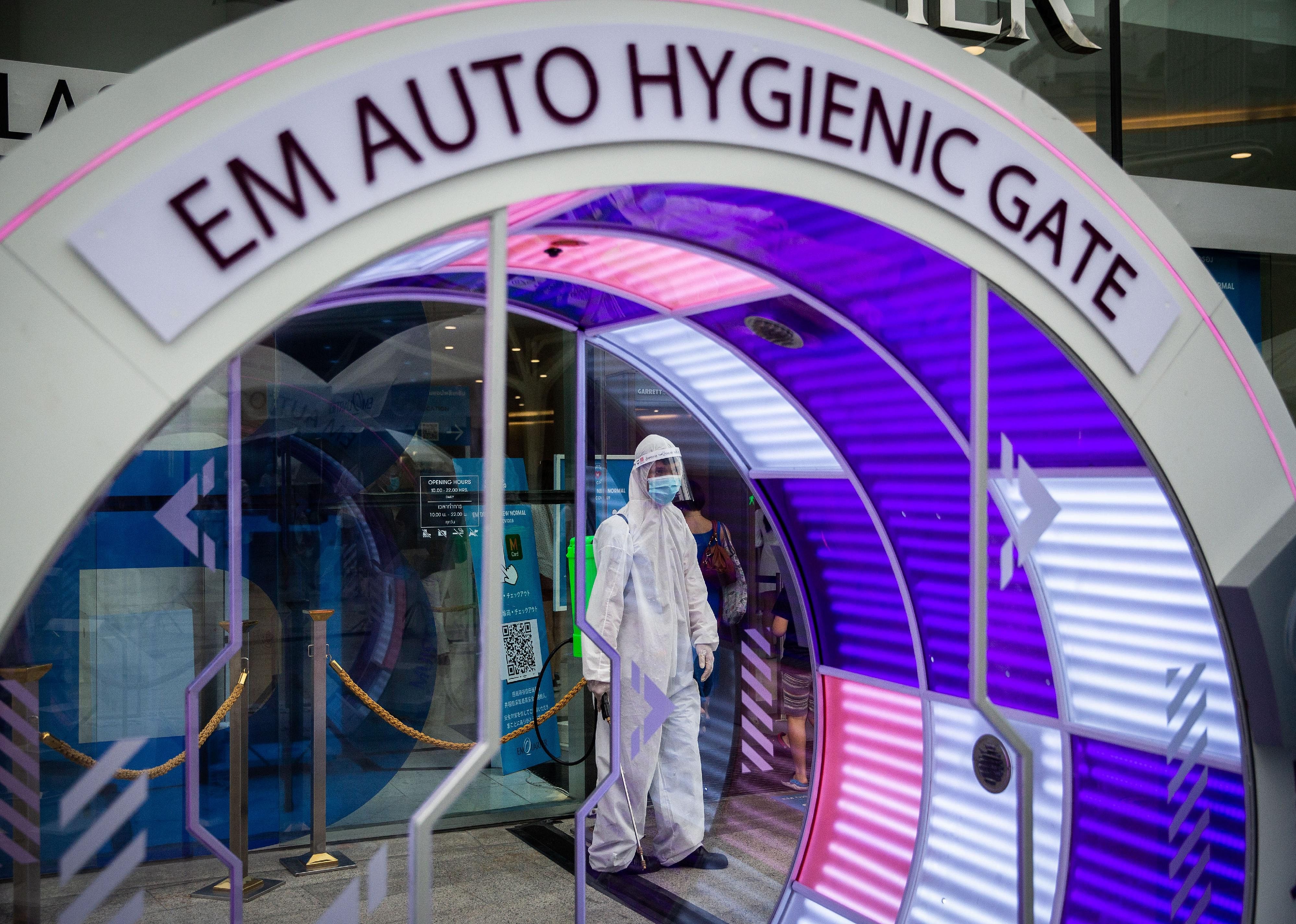 Temperature checks and hazmat suits in a Thailand mall