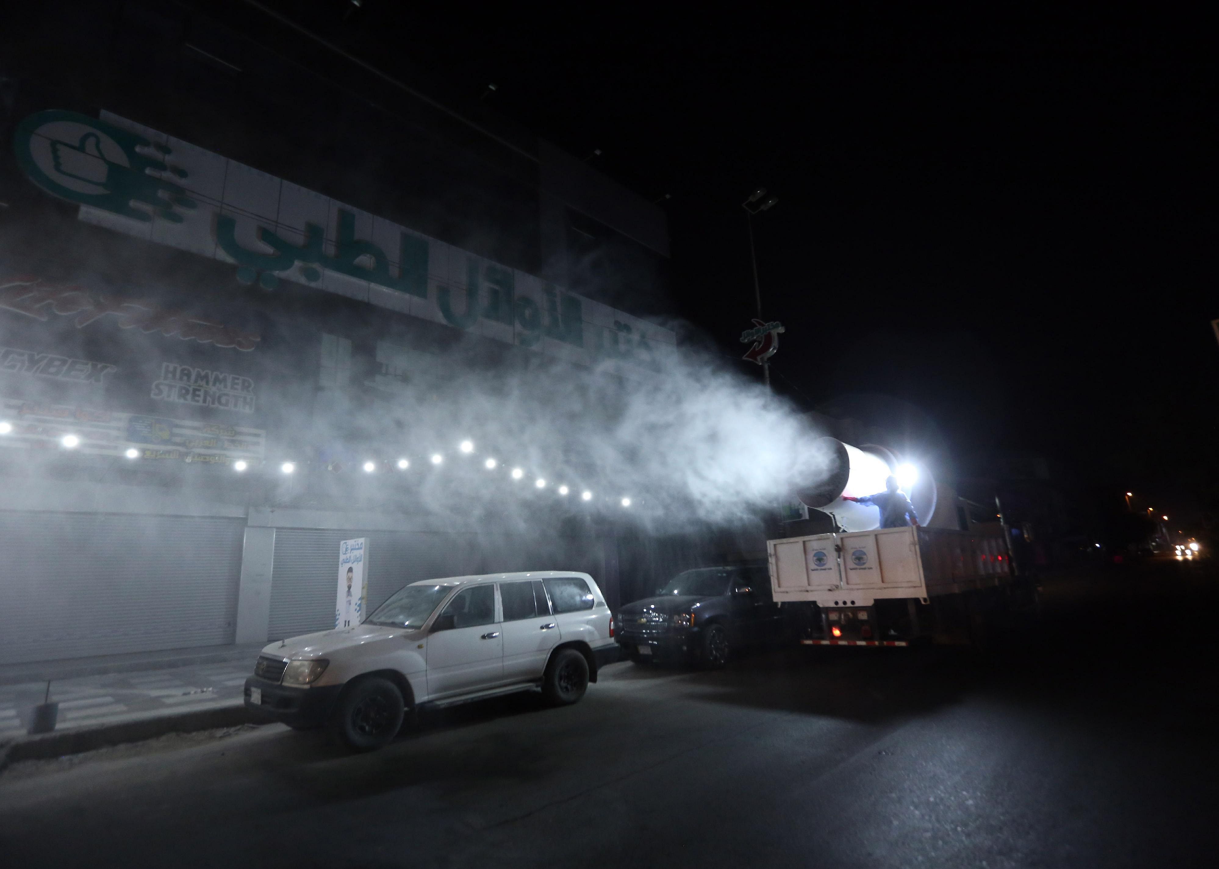 Disinfecting after dark in Baghdad