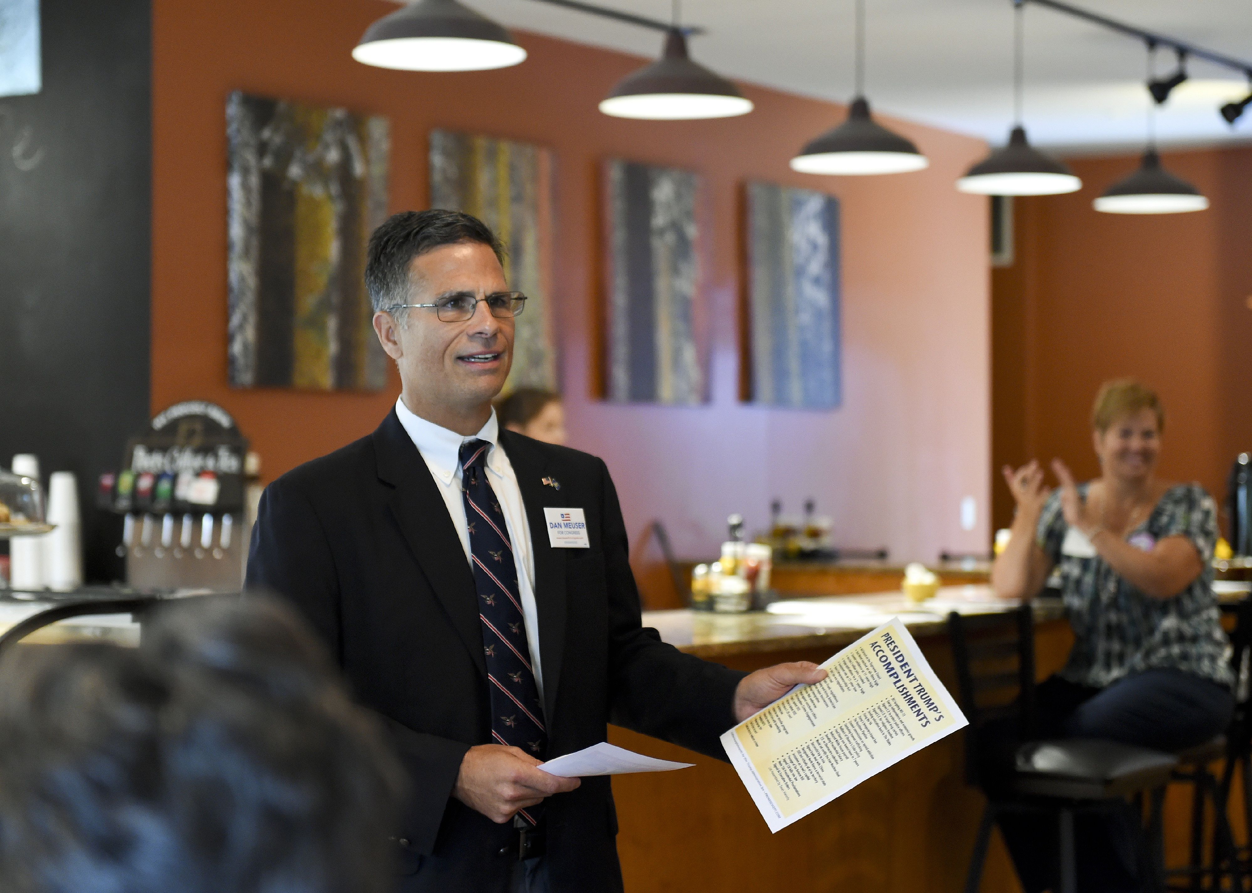 Daniel Meuser speaking at a breakfast event.