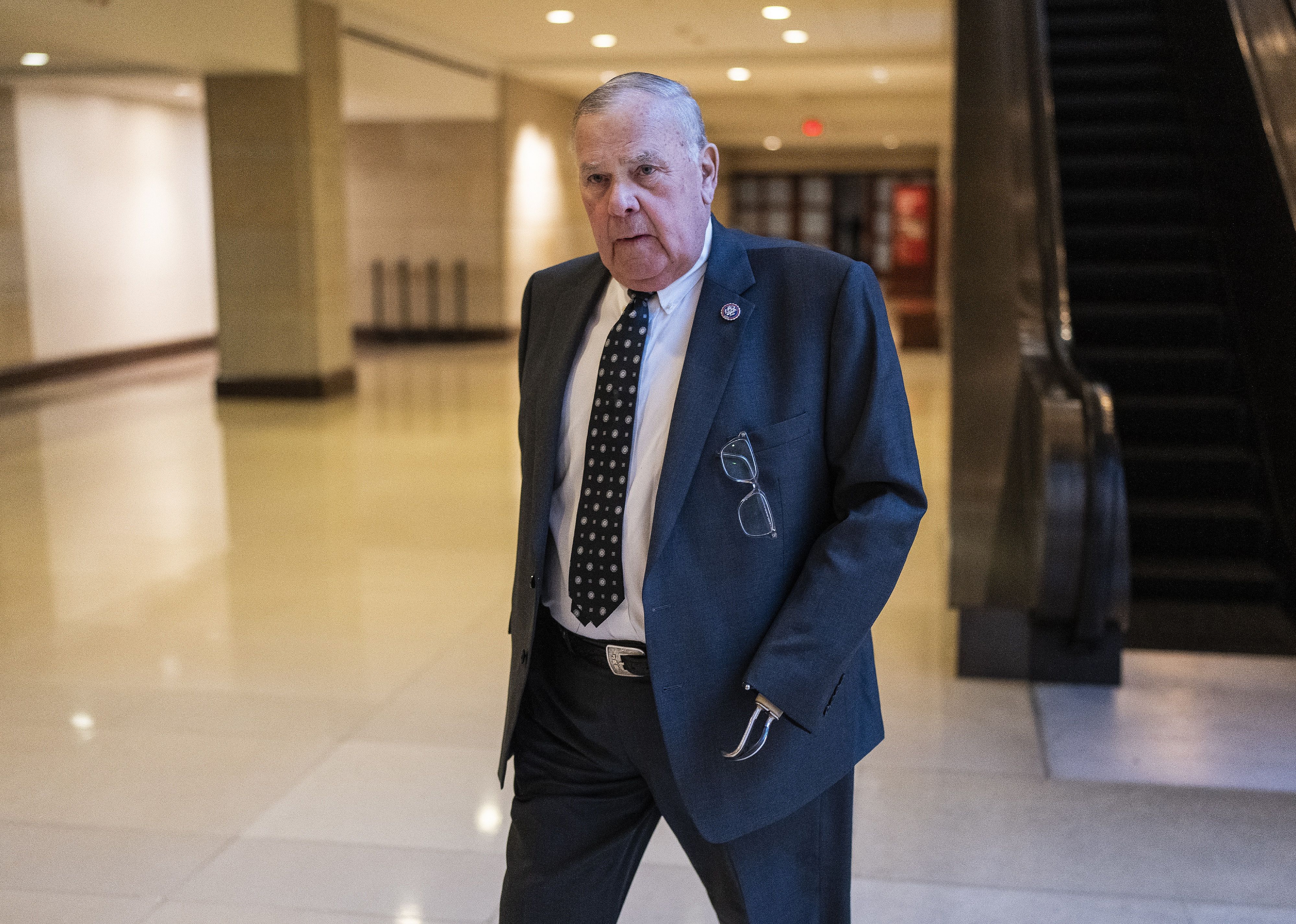James Baird walking down a hallway.