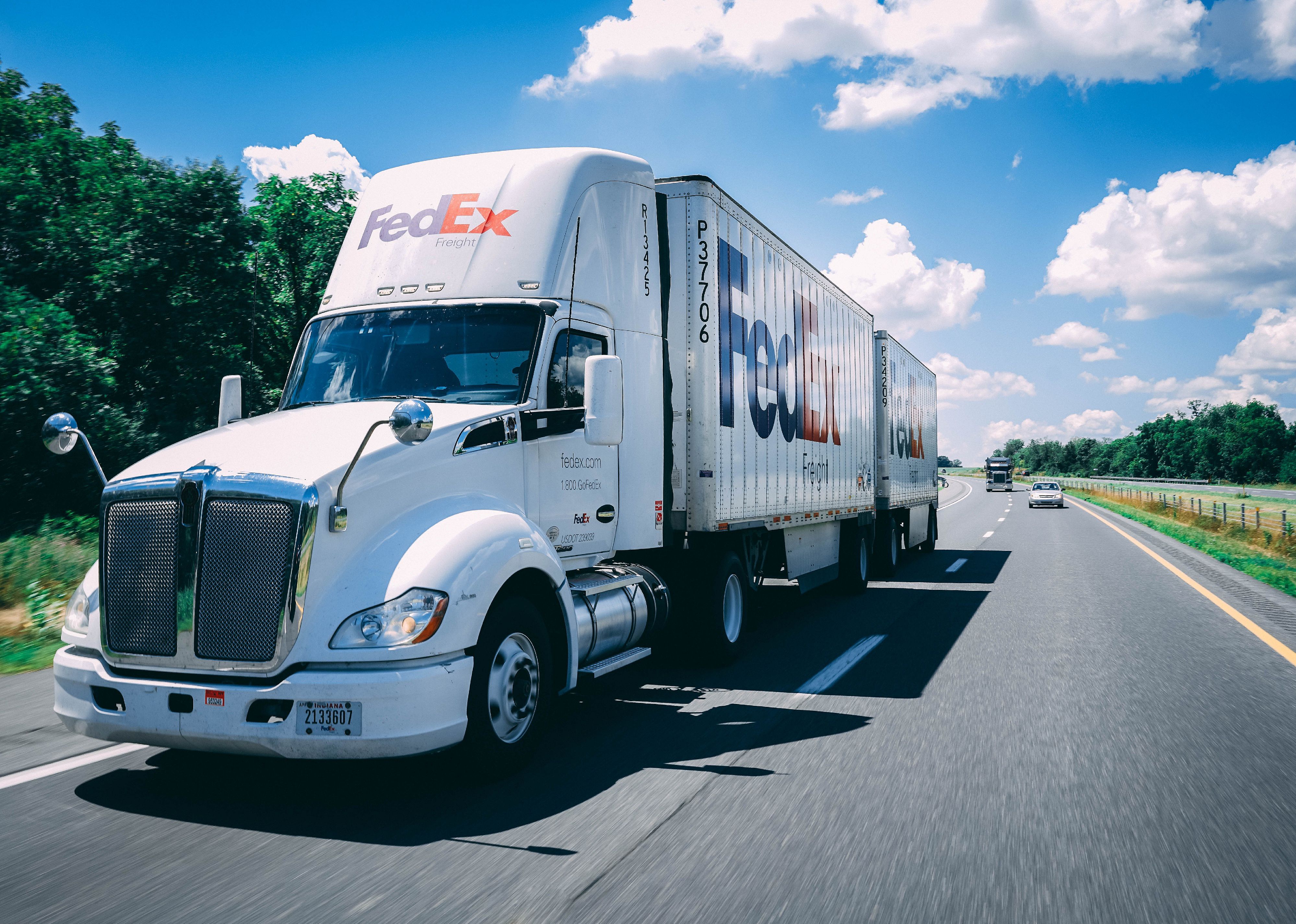 FedEx truck on the highway.