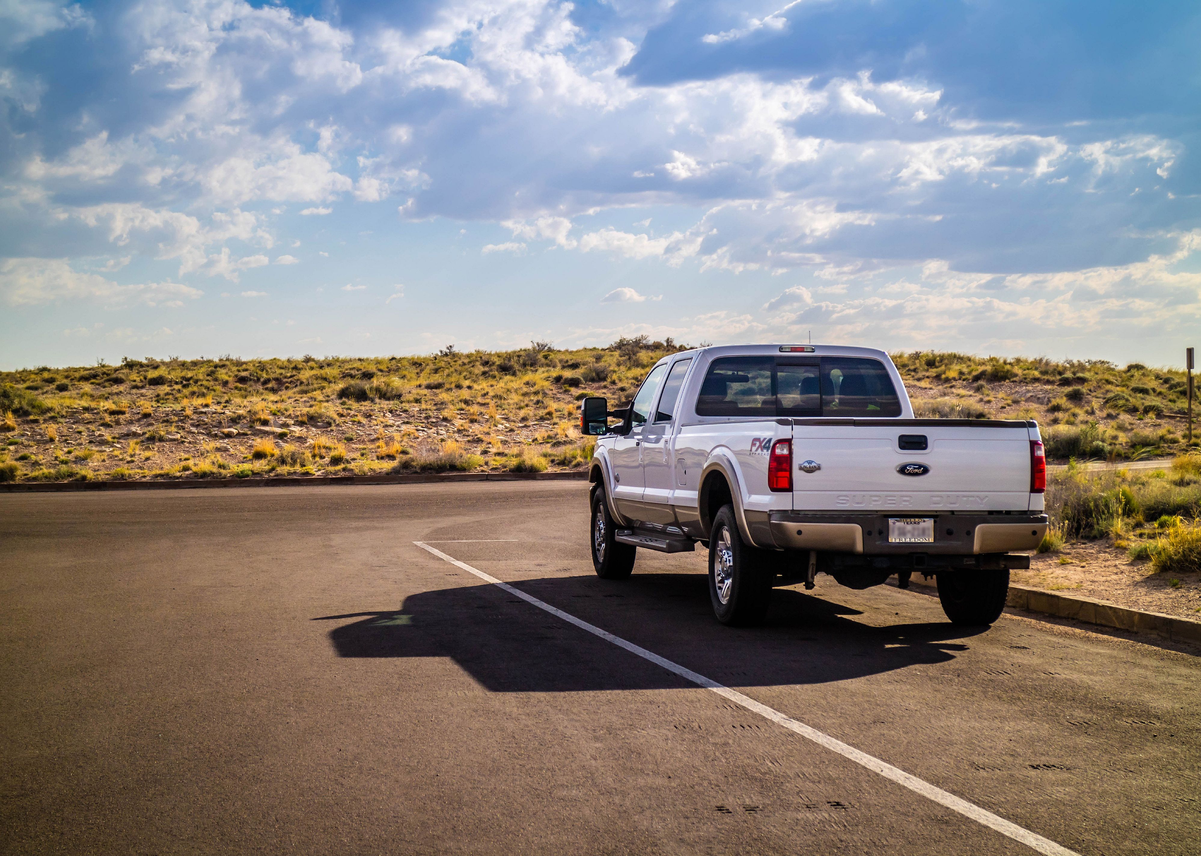 The F350 Ford parked along a preserve park.