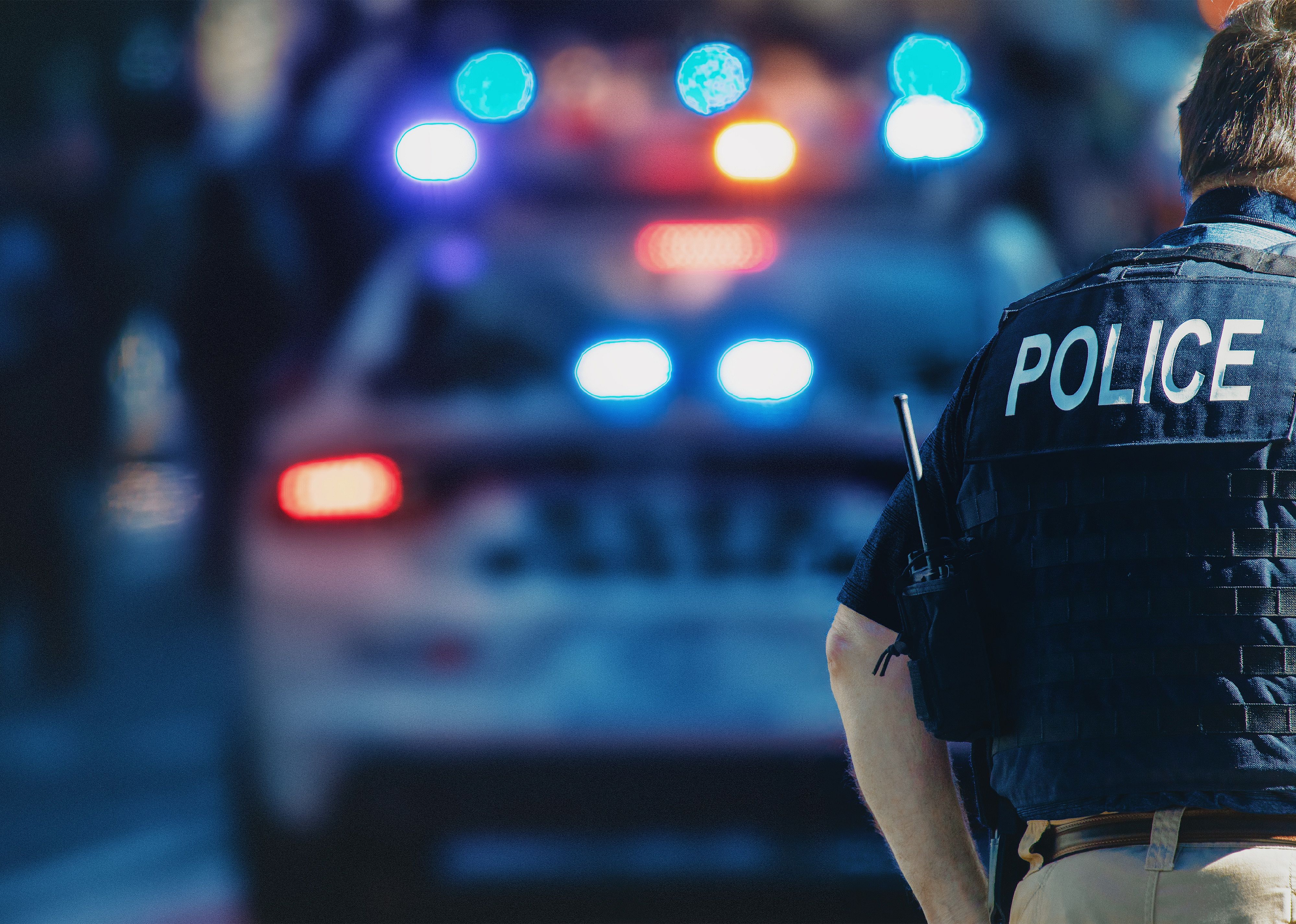 American policeman and police car in the background.