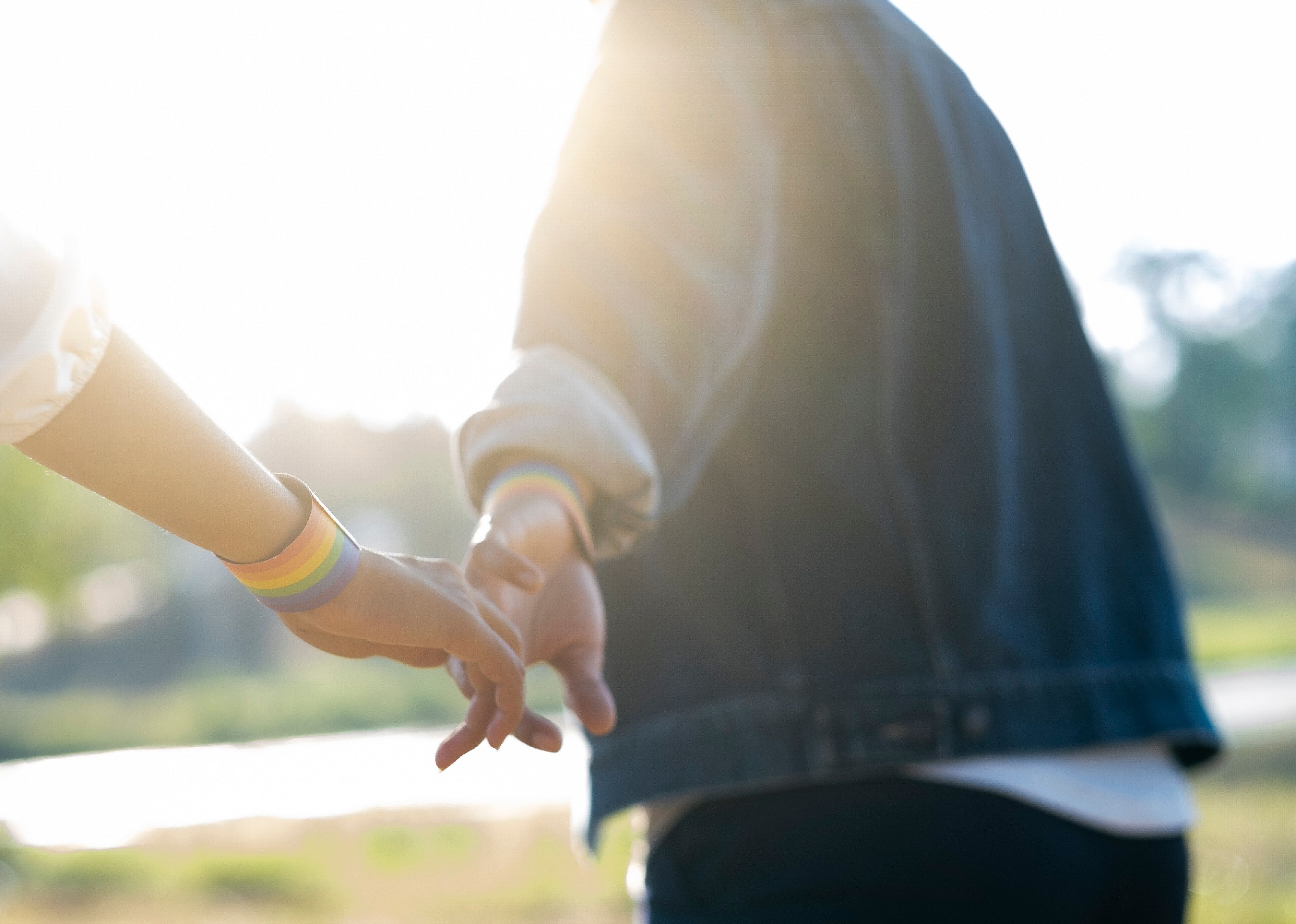 Close-up hands of LGBTQ+ couple.