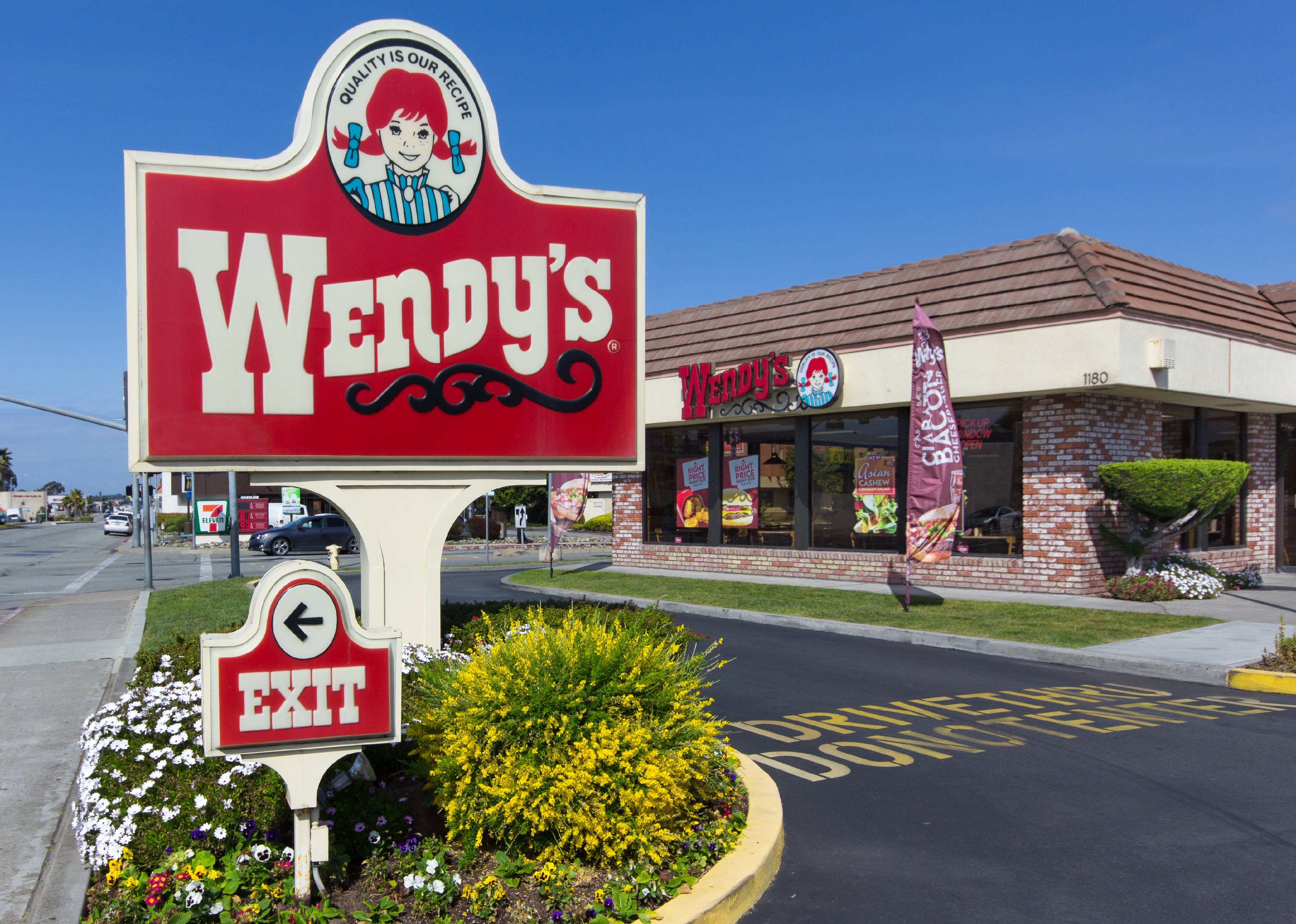 The Wendy's sign outside a Wendy's restaurant.