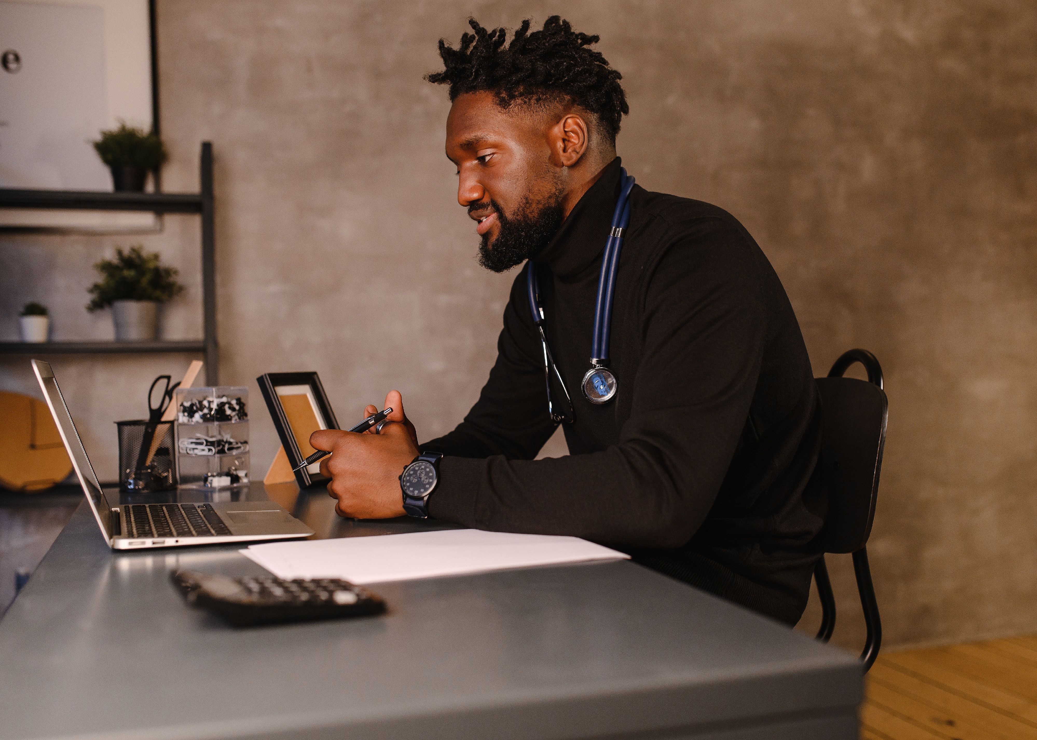 Man at desk for online therapy session