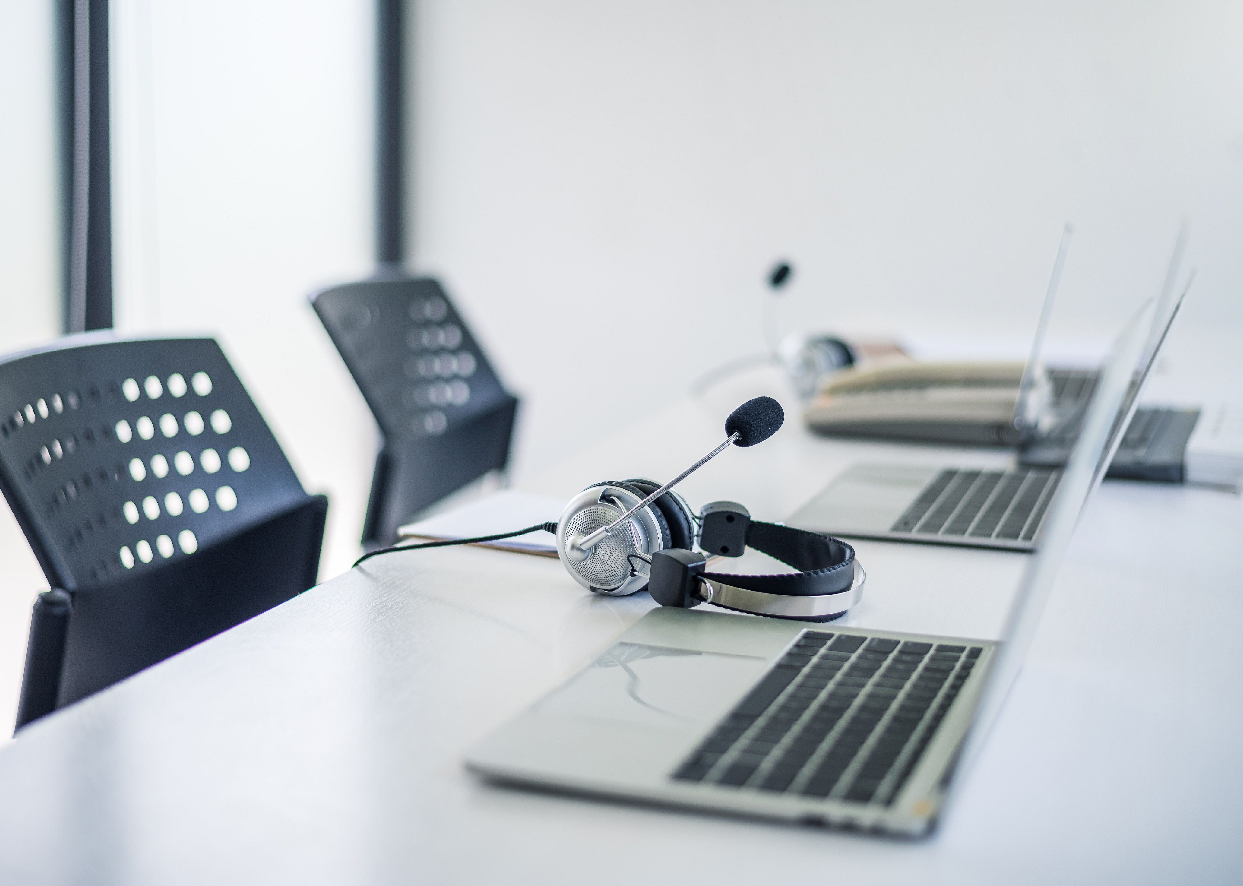 Call center equipment on a table at a office.