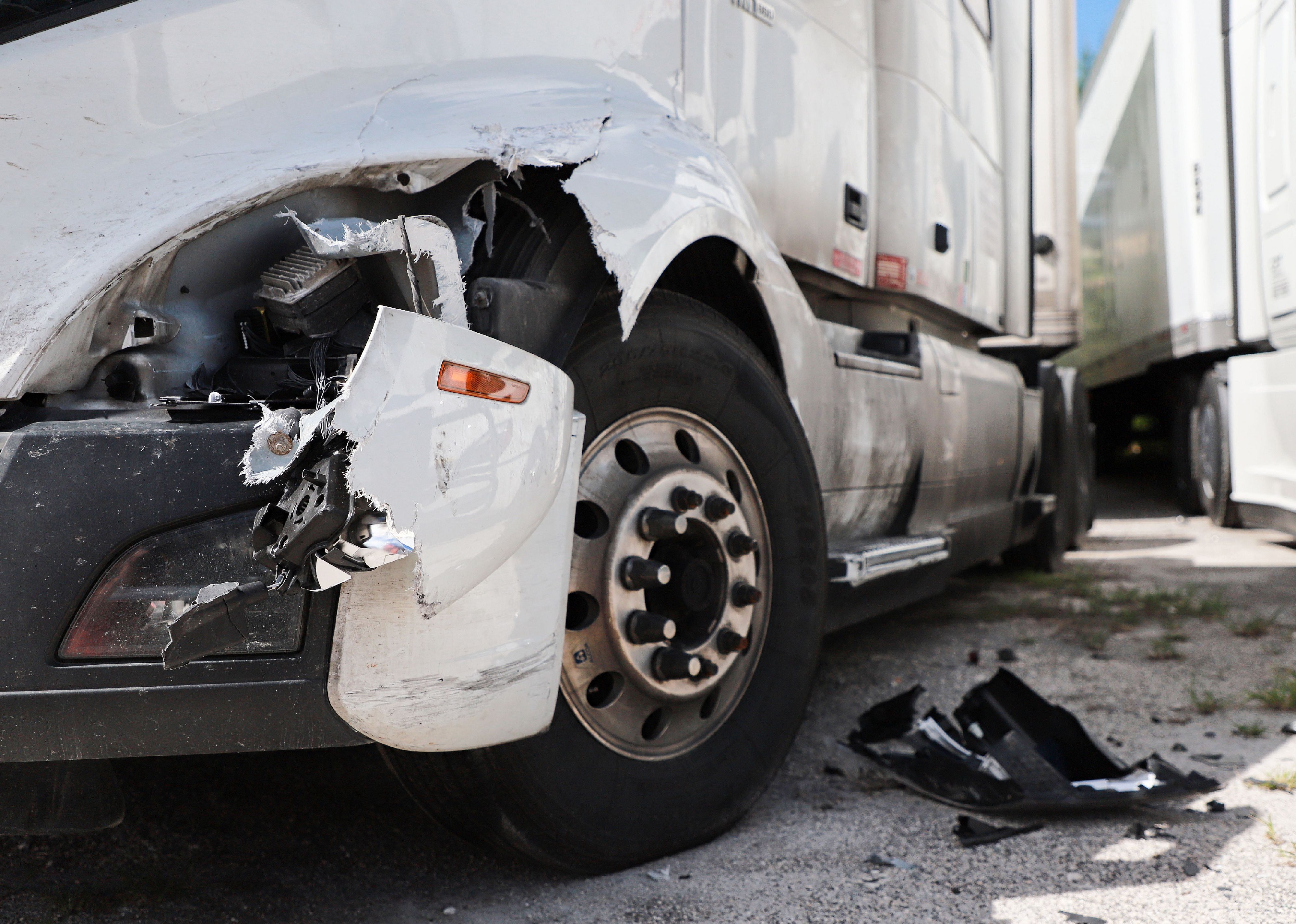 Damage closeup on white truck