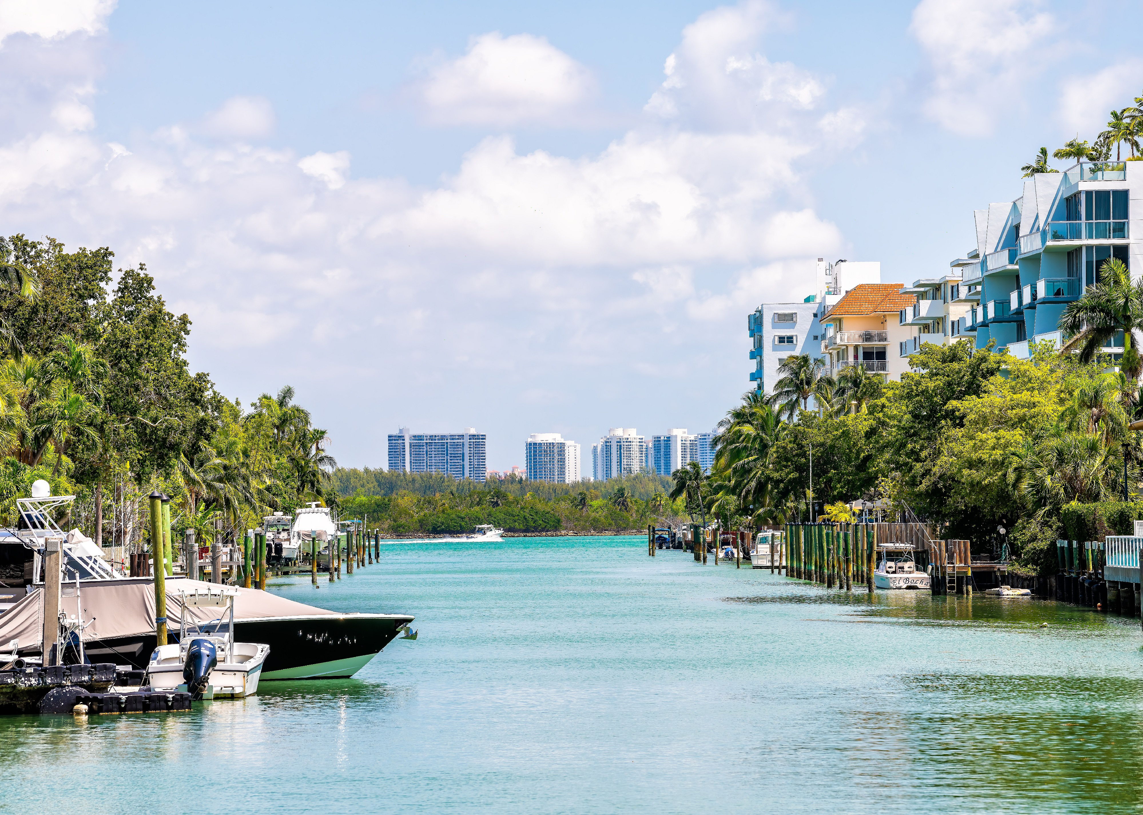 Biscayne Bay water by residential homes with private boat docks.