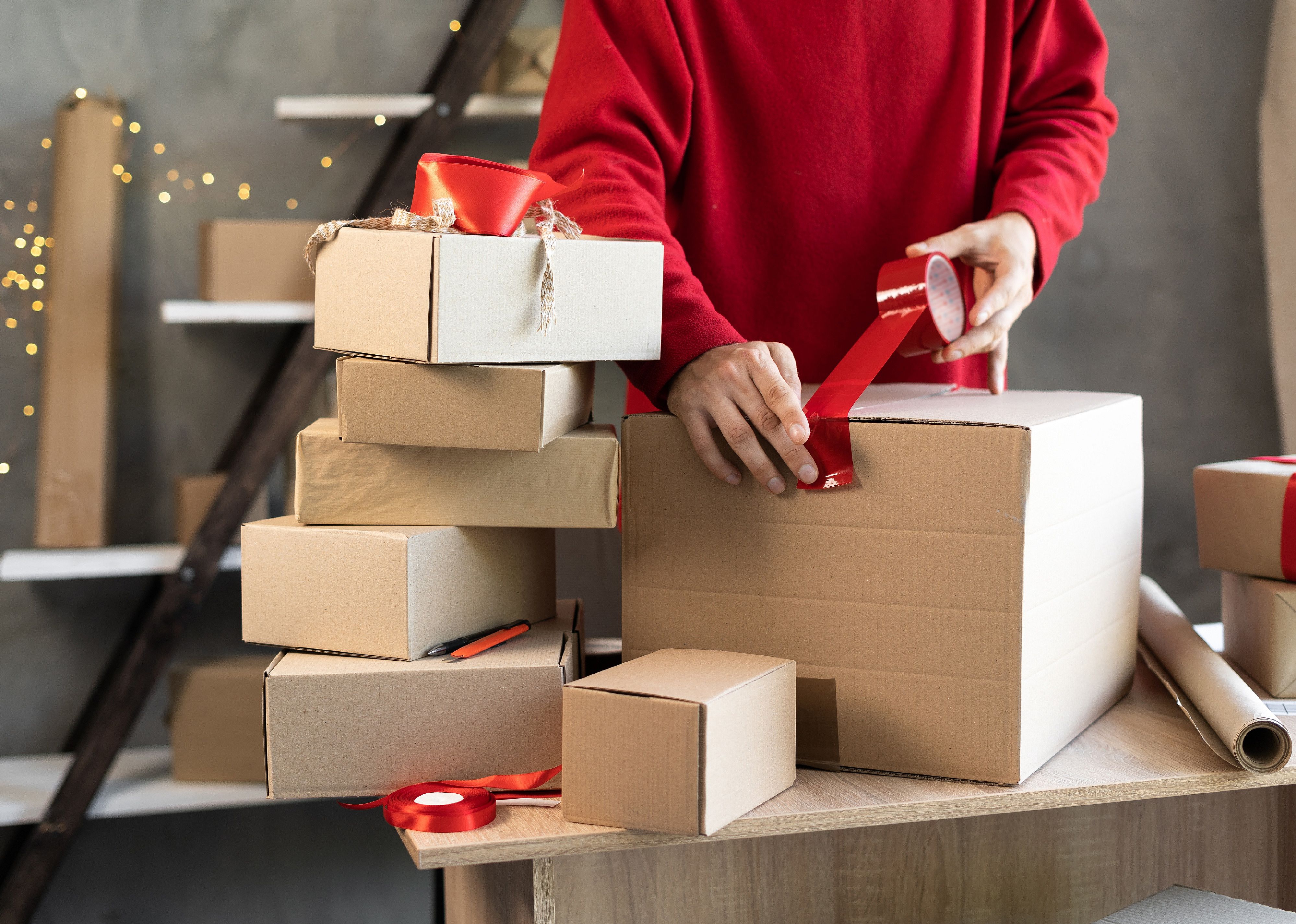 Man packing boxes for shipment.