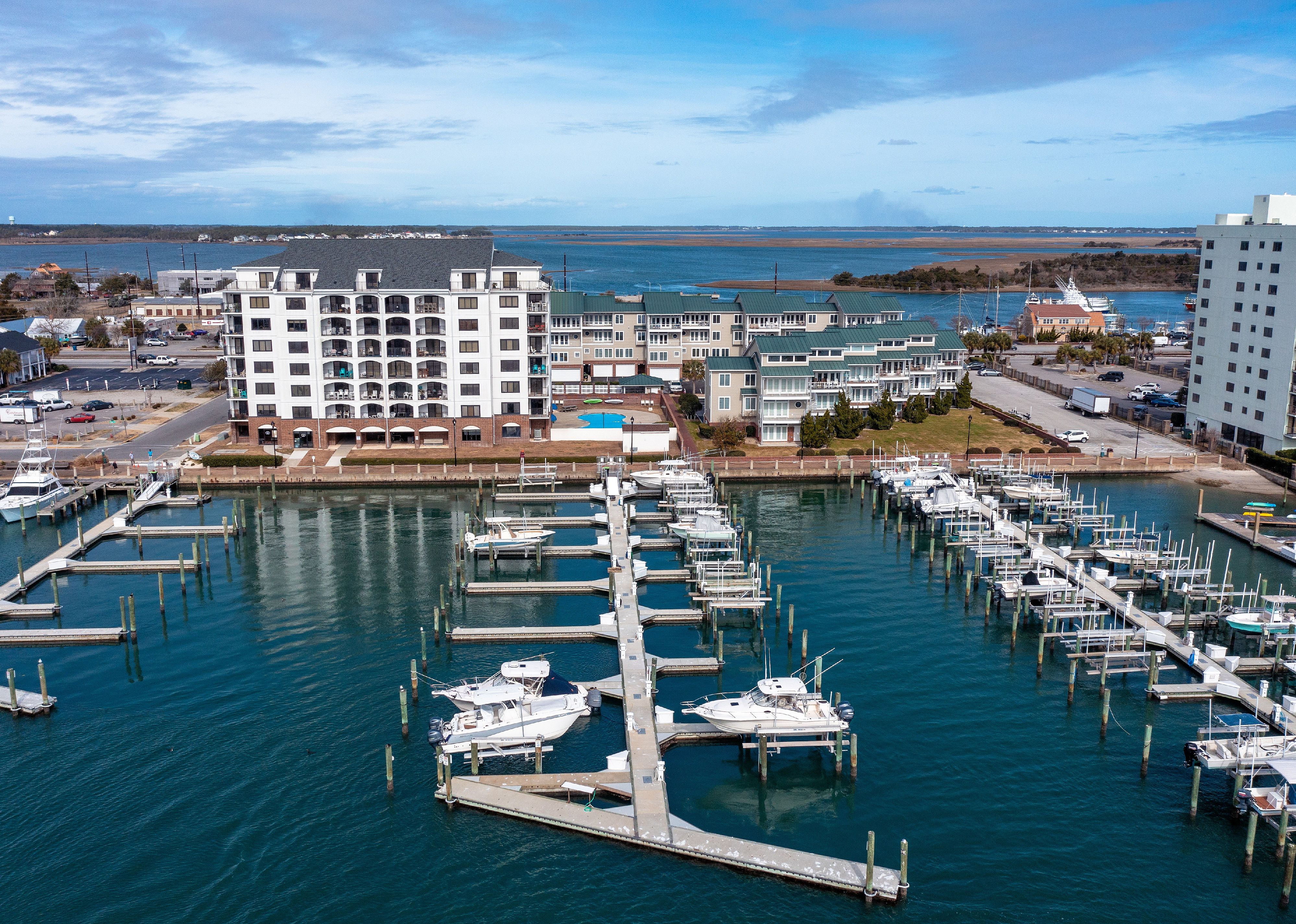 Aerial view of condos and a marina with boats in Morehead City, North Carolina.
