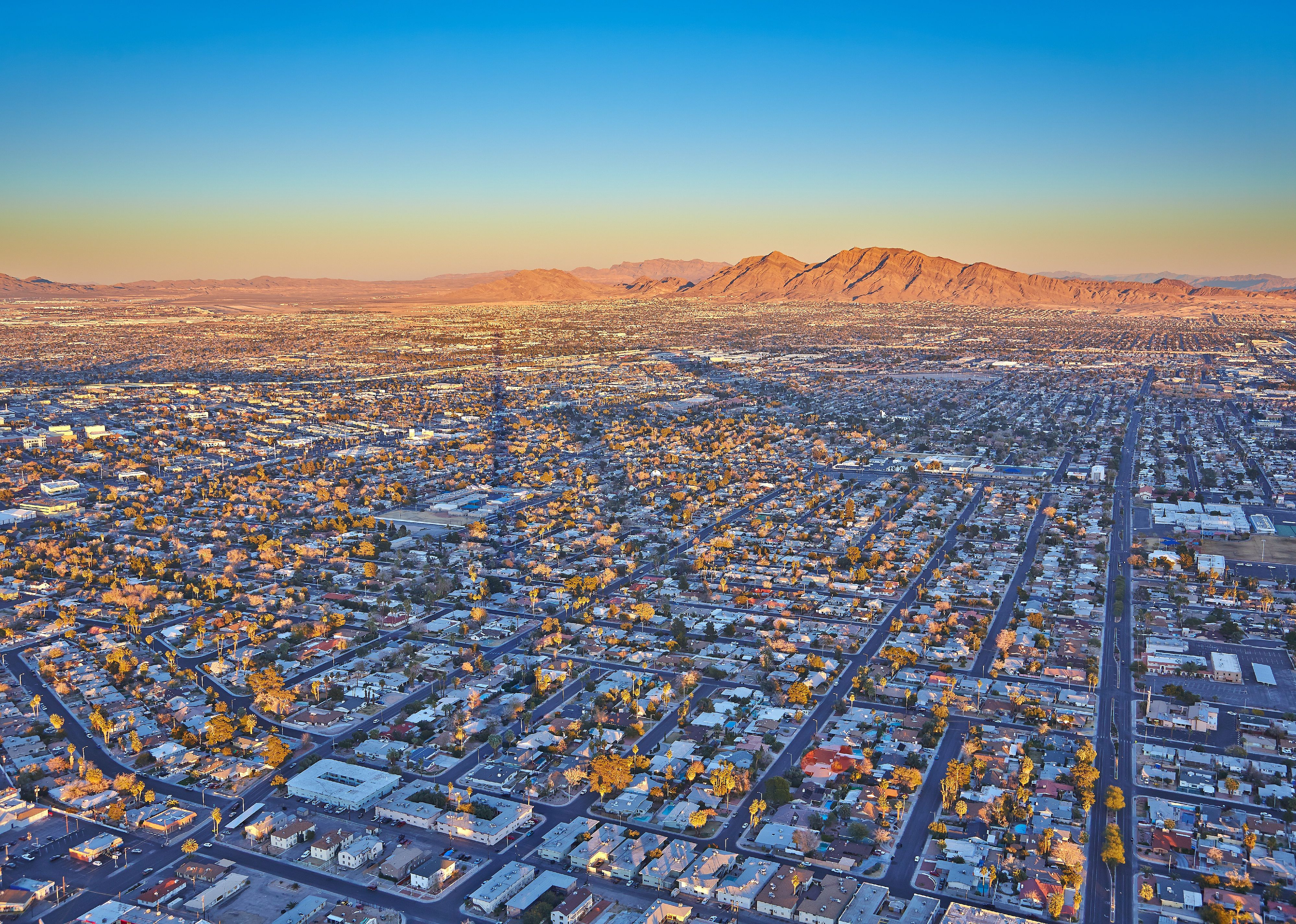 Top view of the sunset, mountains and houses in Las Vegas.