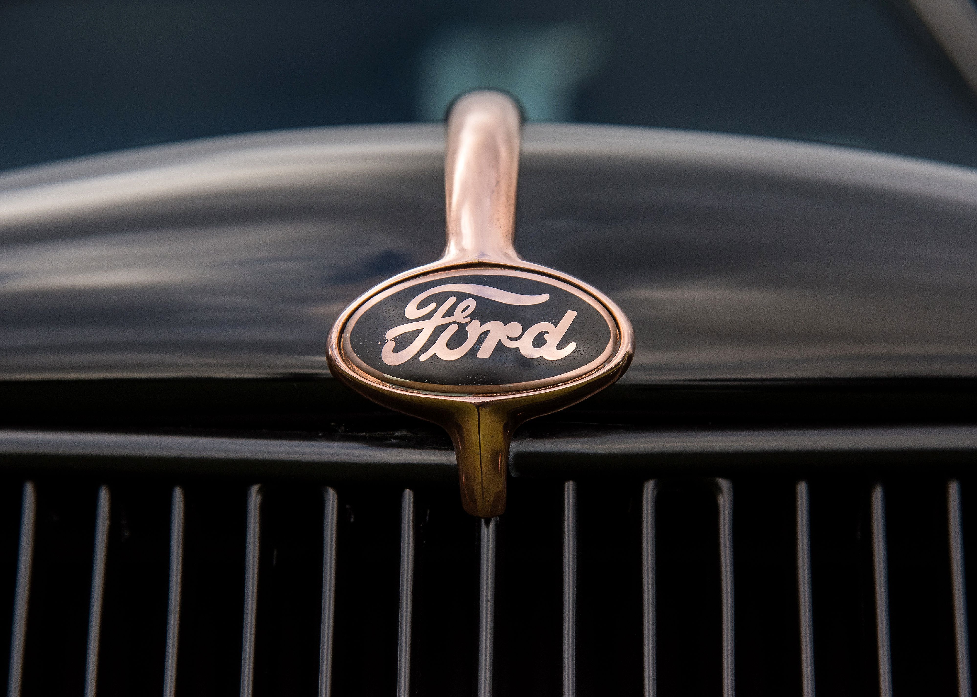 Vintage Ford truck black and gold logo and grill.