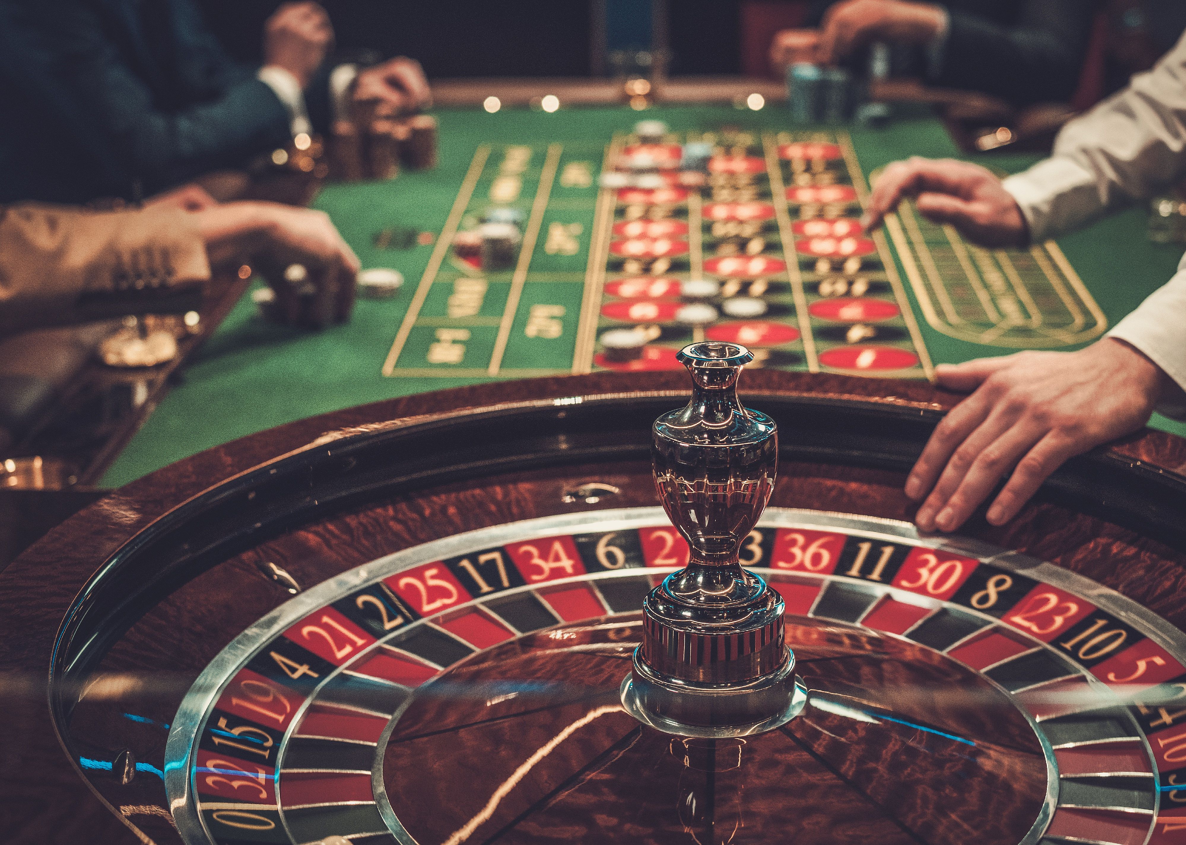 Side view of a roulette table in a luxury casino.