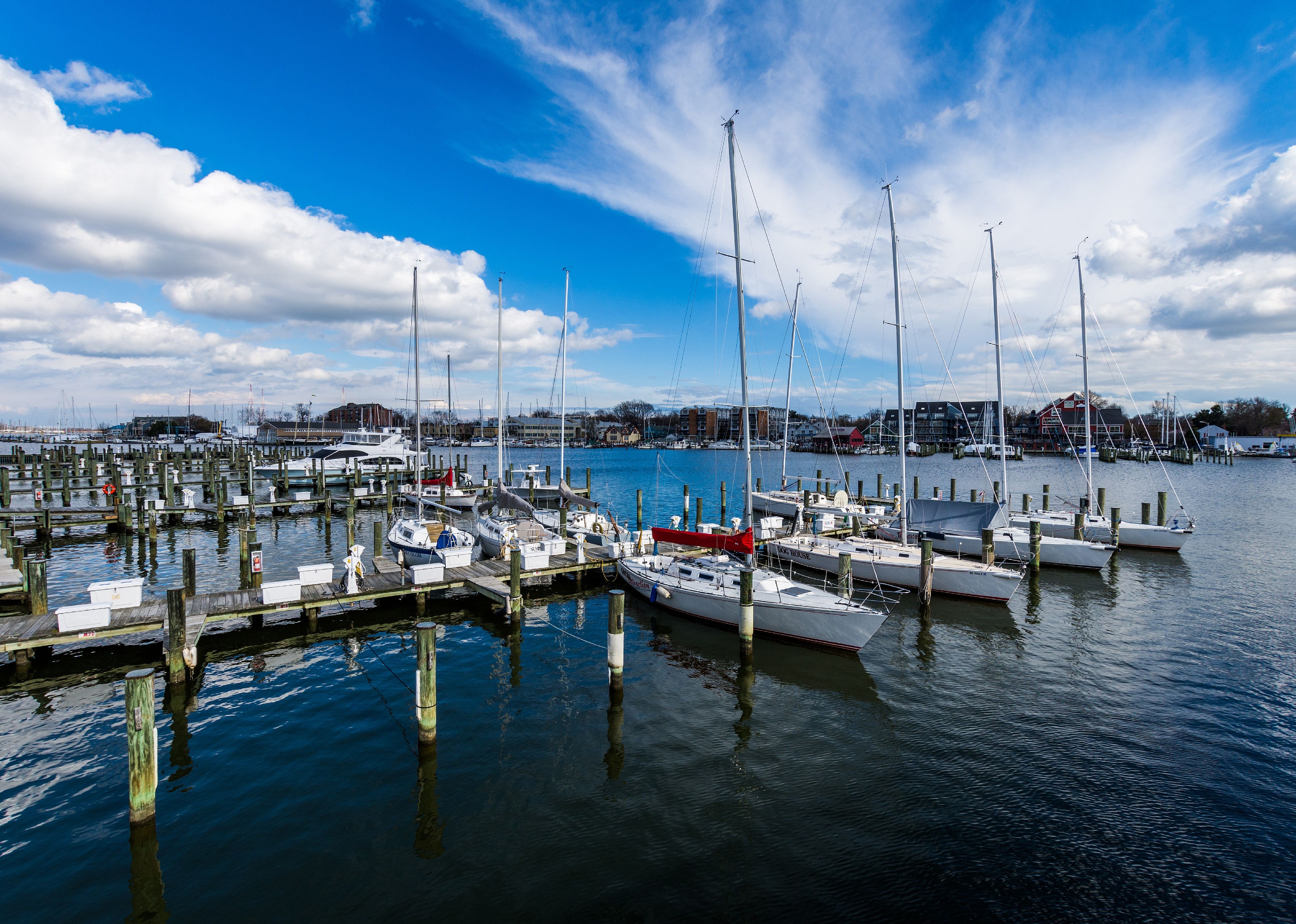 Harbor Area of Annapolis on a cloudy spring day with sail boats.