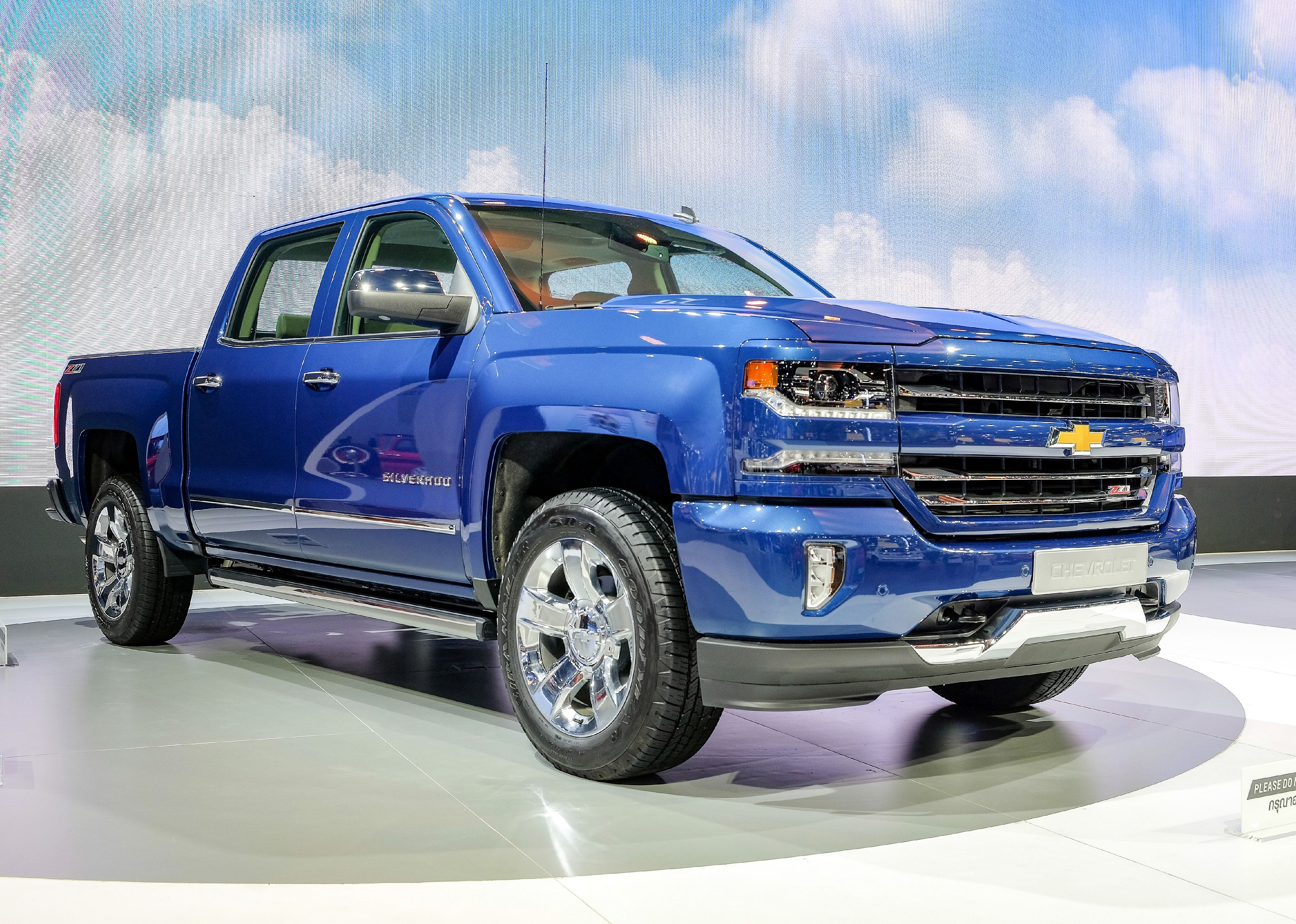A blue Chevrolet Silverado on display.