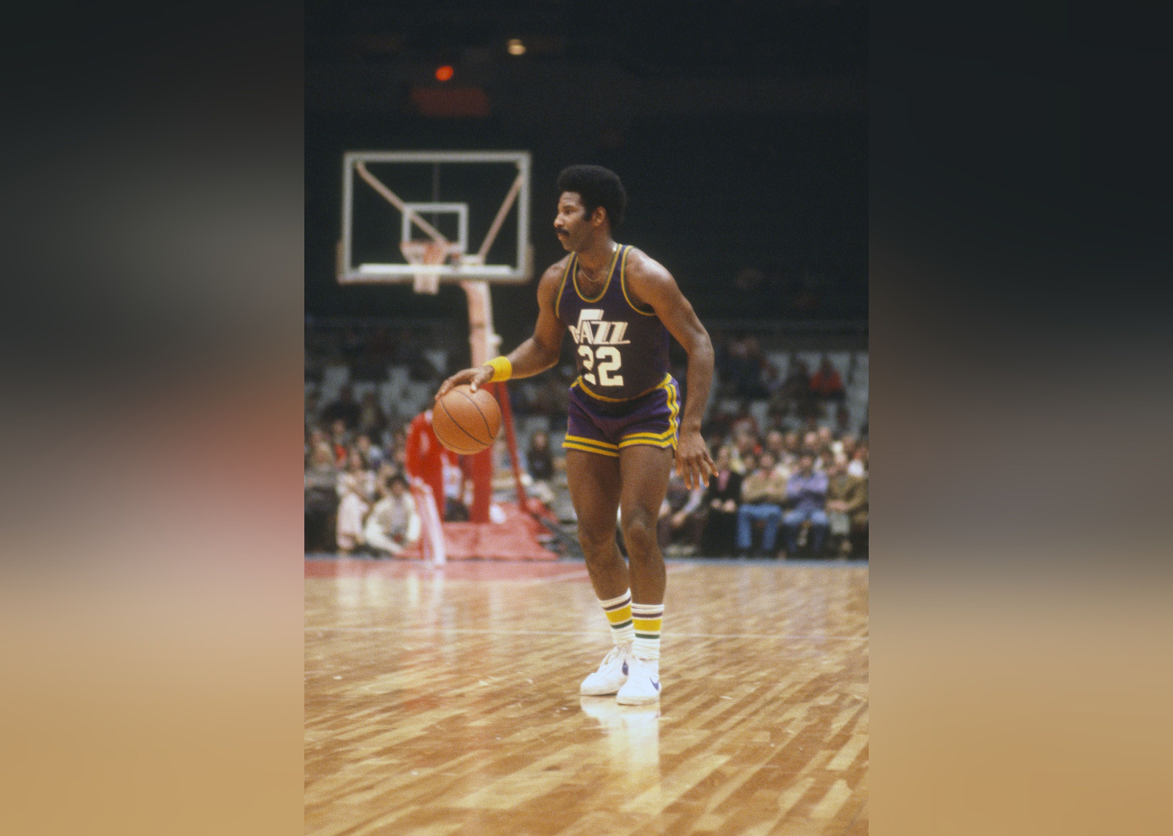 Nate Williams of the New Orleans Jazz dribbles the ball against the New York Net.