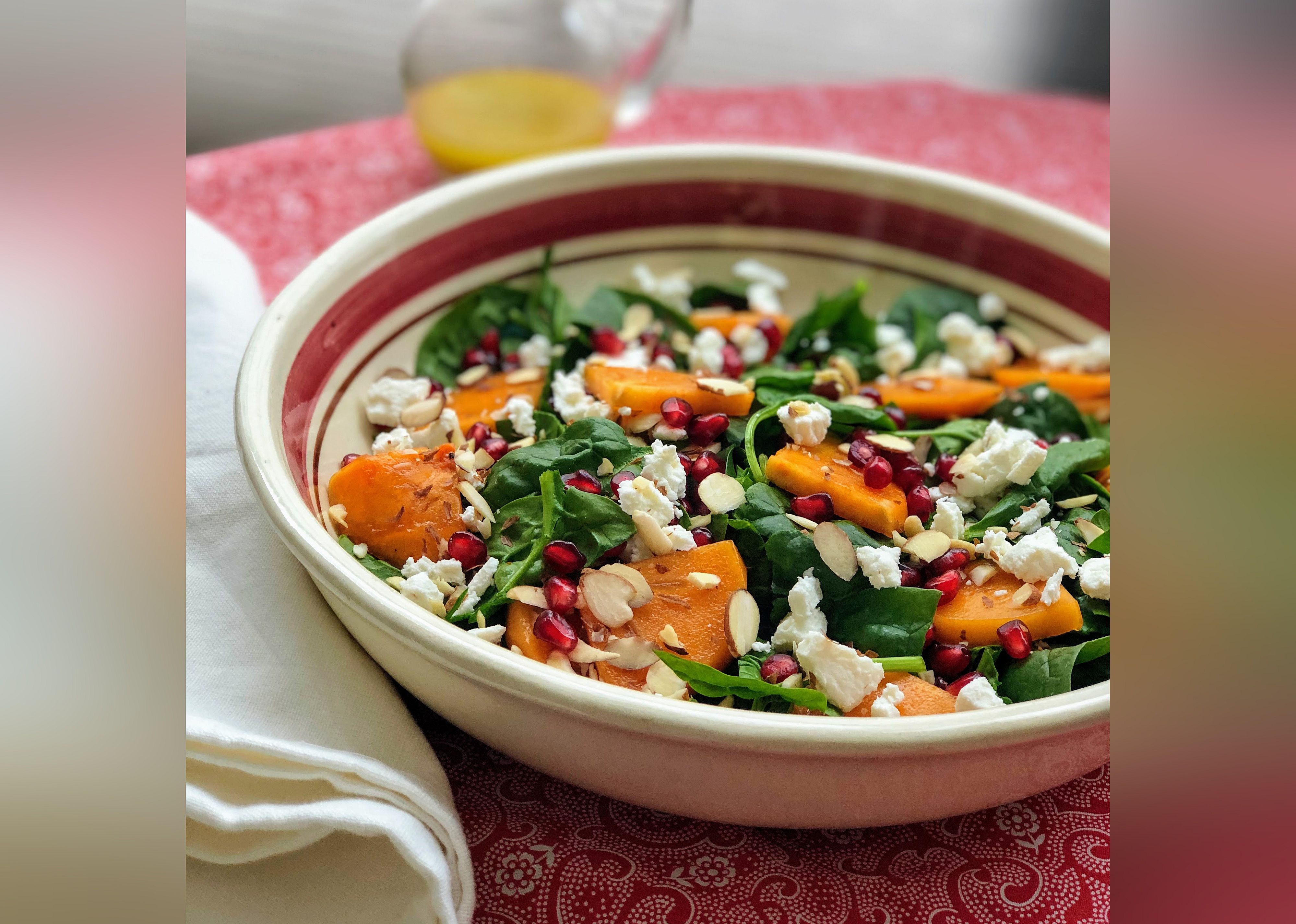 Spinach and Persimmon Salad with Goat Cheese and Pomegranate