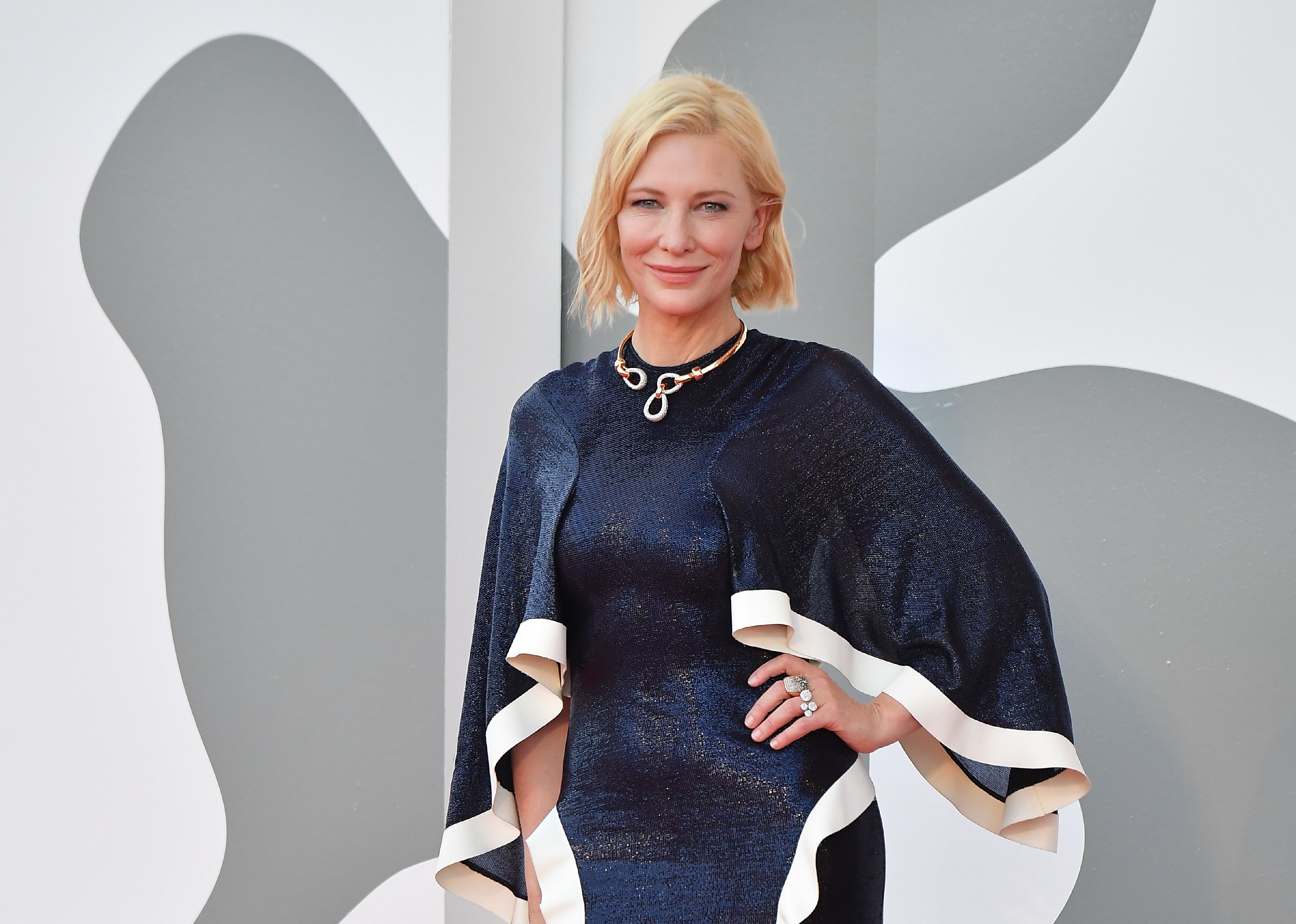 Cate Blanchett in a sparkling blue caped gown.