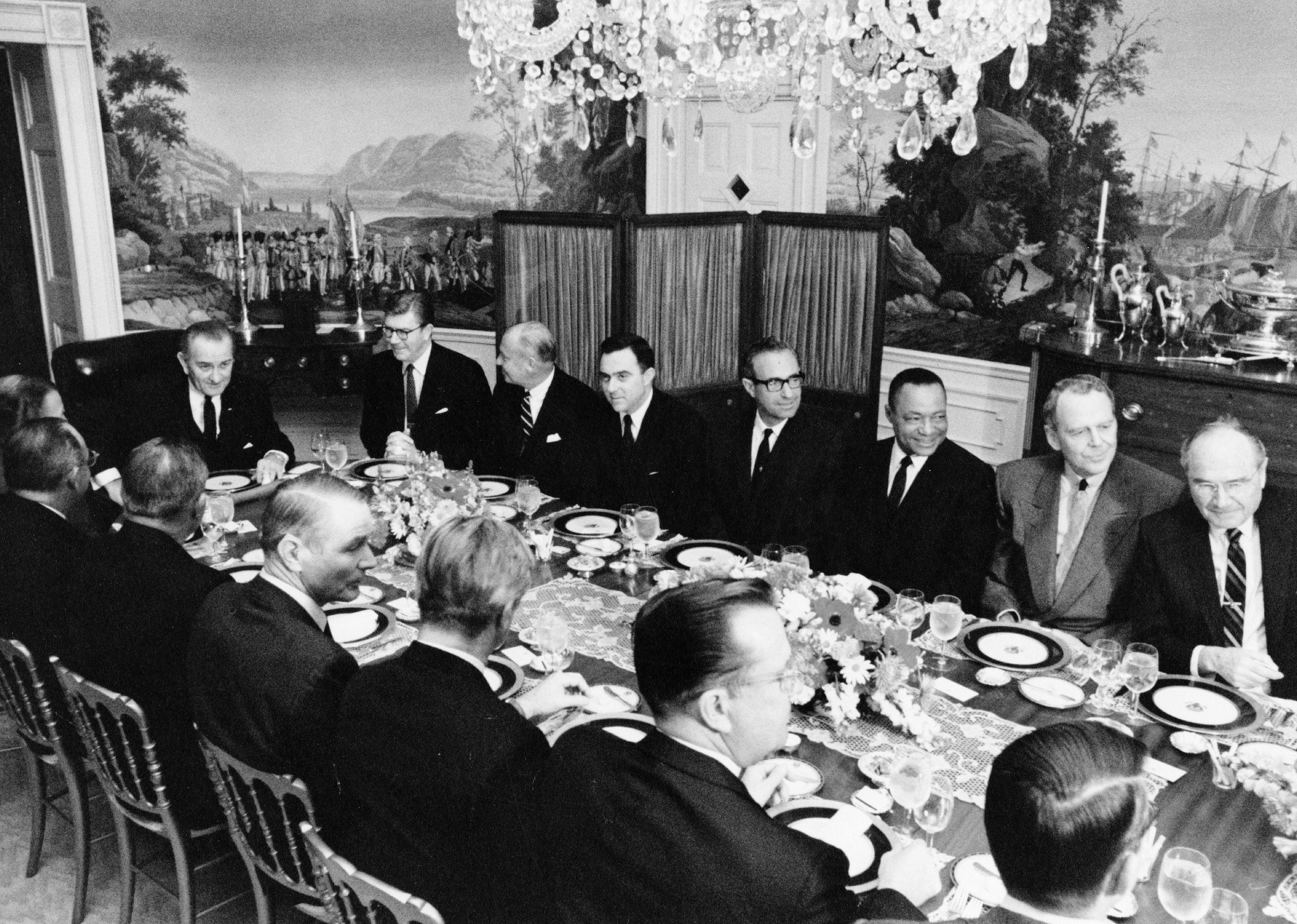 President Lyndon Johnson hosts a dinner meeting in the White House