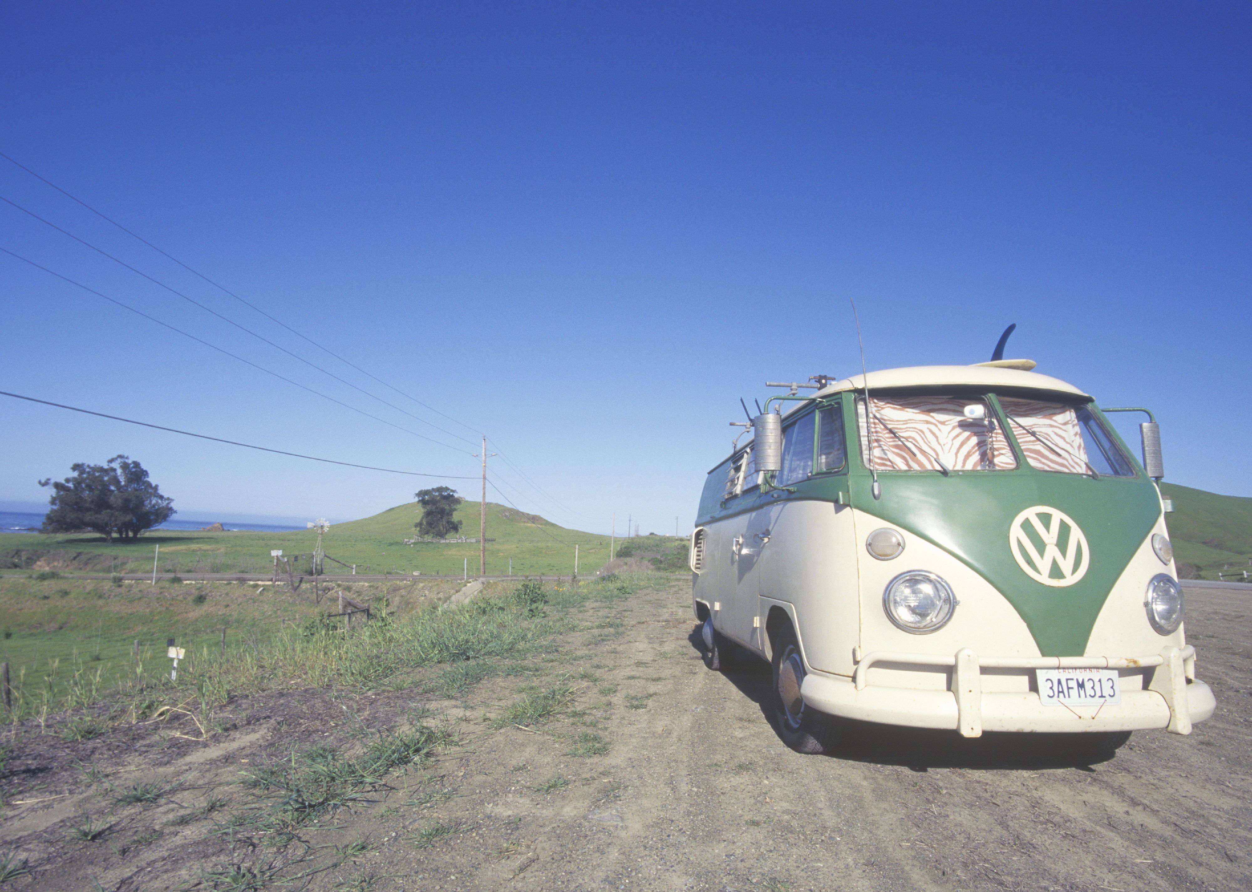 A Volkswagen van parked on the roadside.