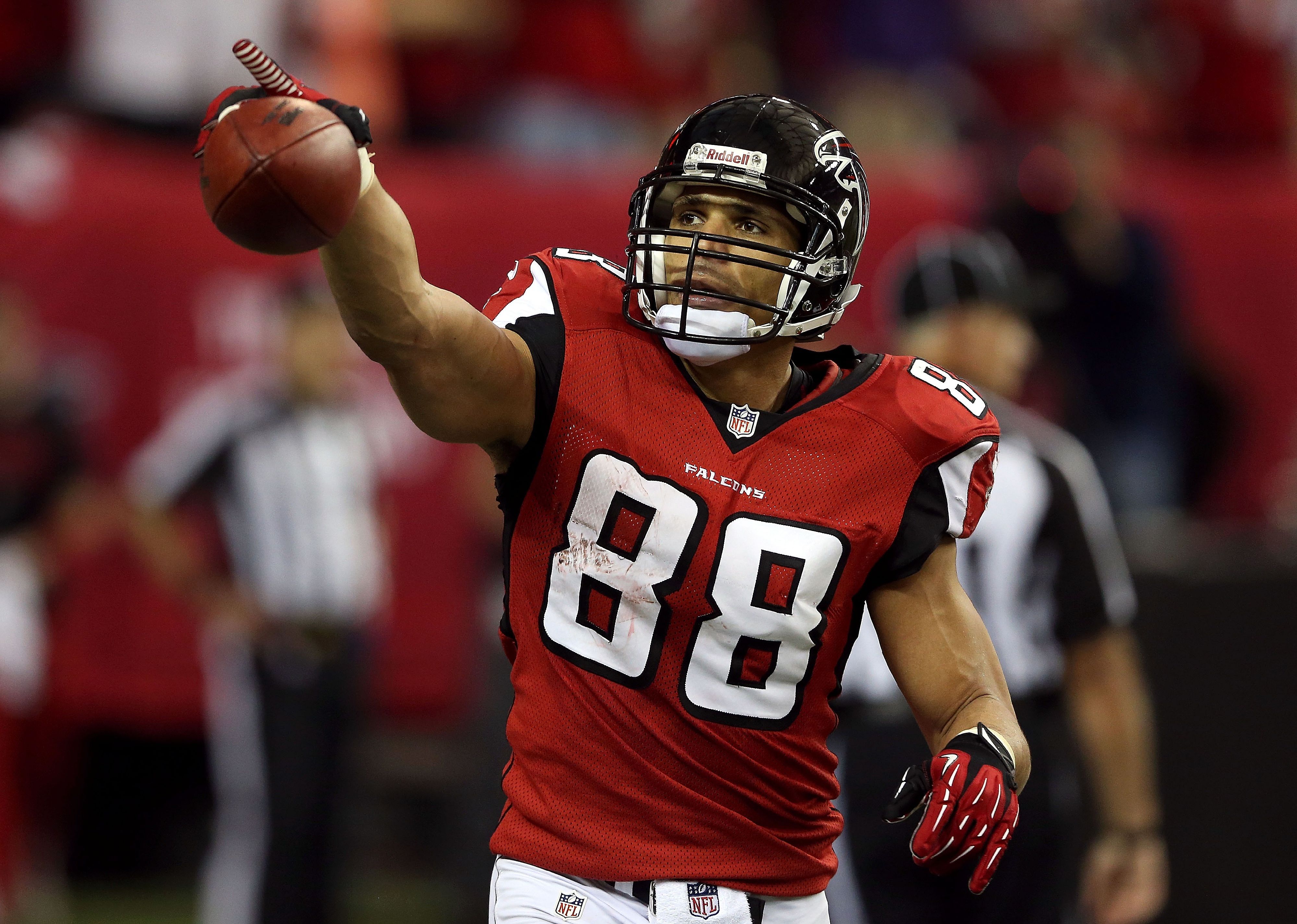 Tony Gonzalez of the Atlanta Falcons celebrates after catching a touchdown