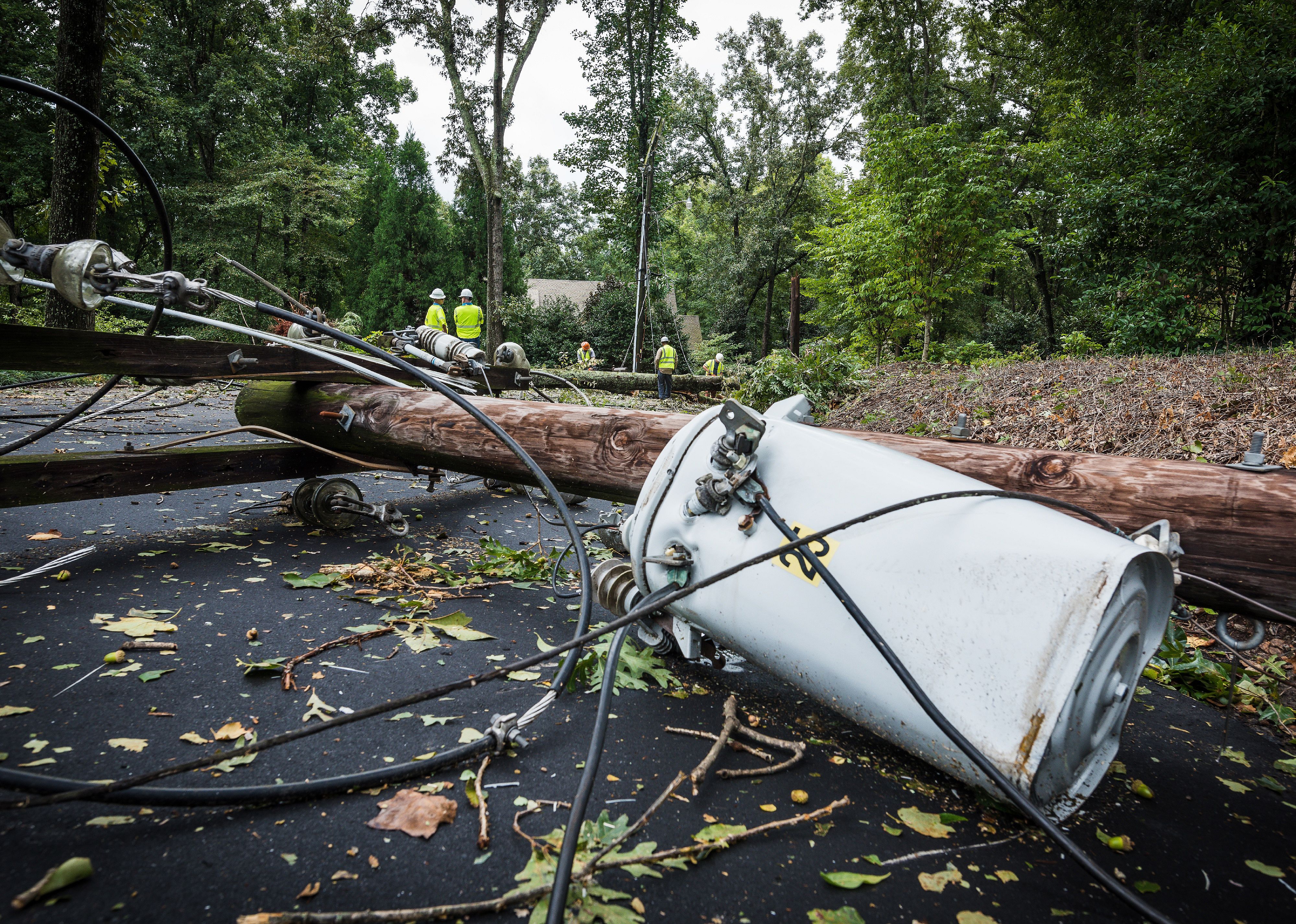 Down power lines and electric equipment in residential neighborhood.
