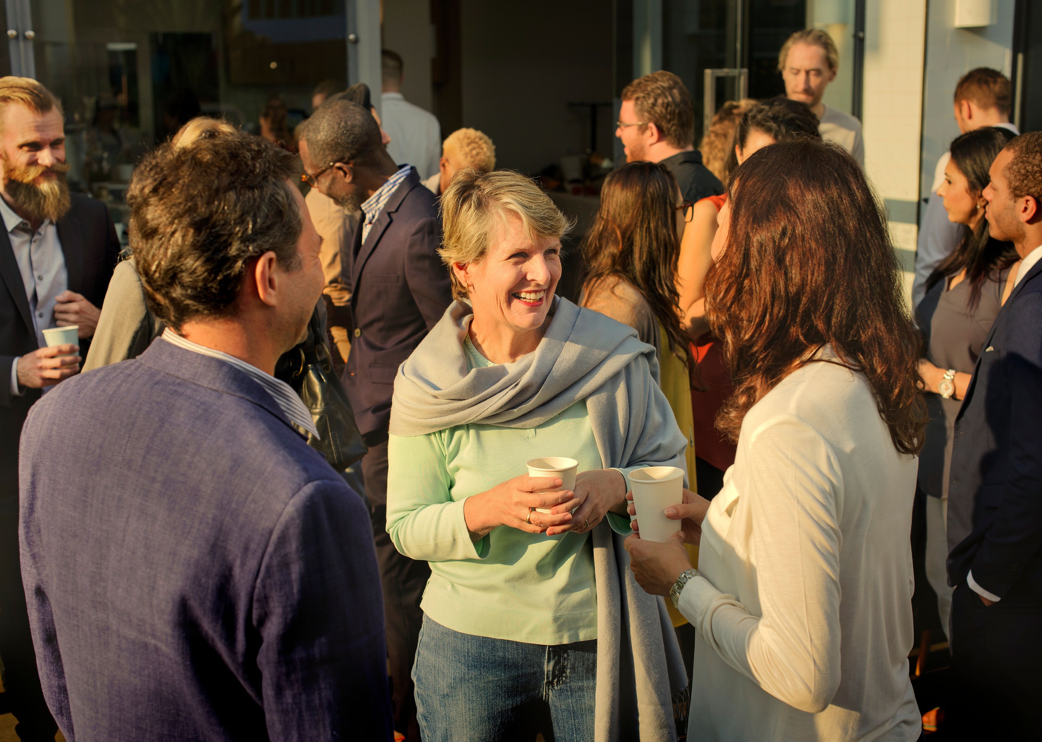 Diverse people mingling at an event.