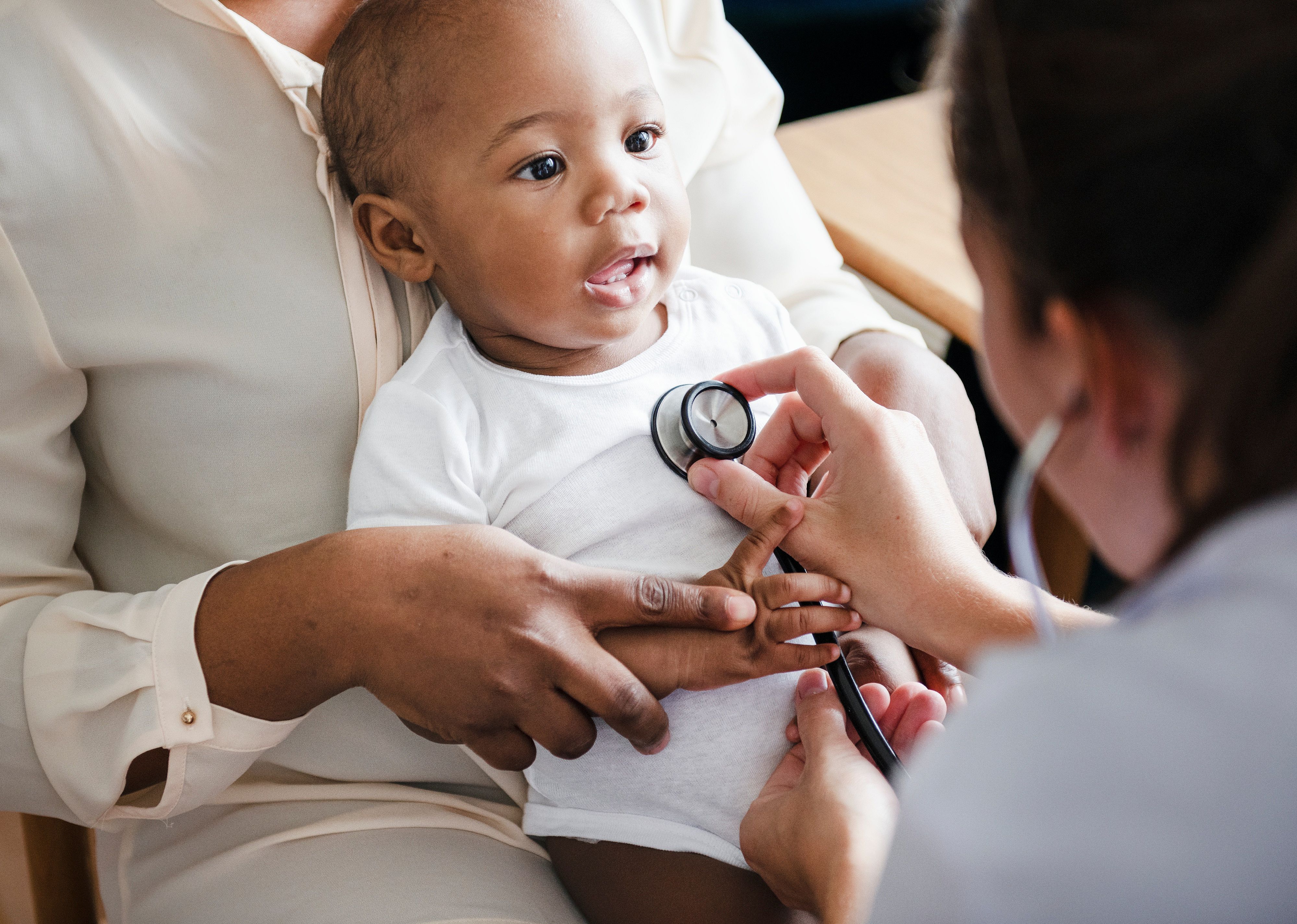 Baby at a visit with a doctor.