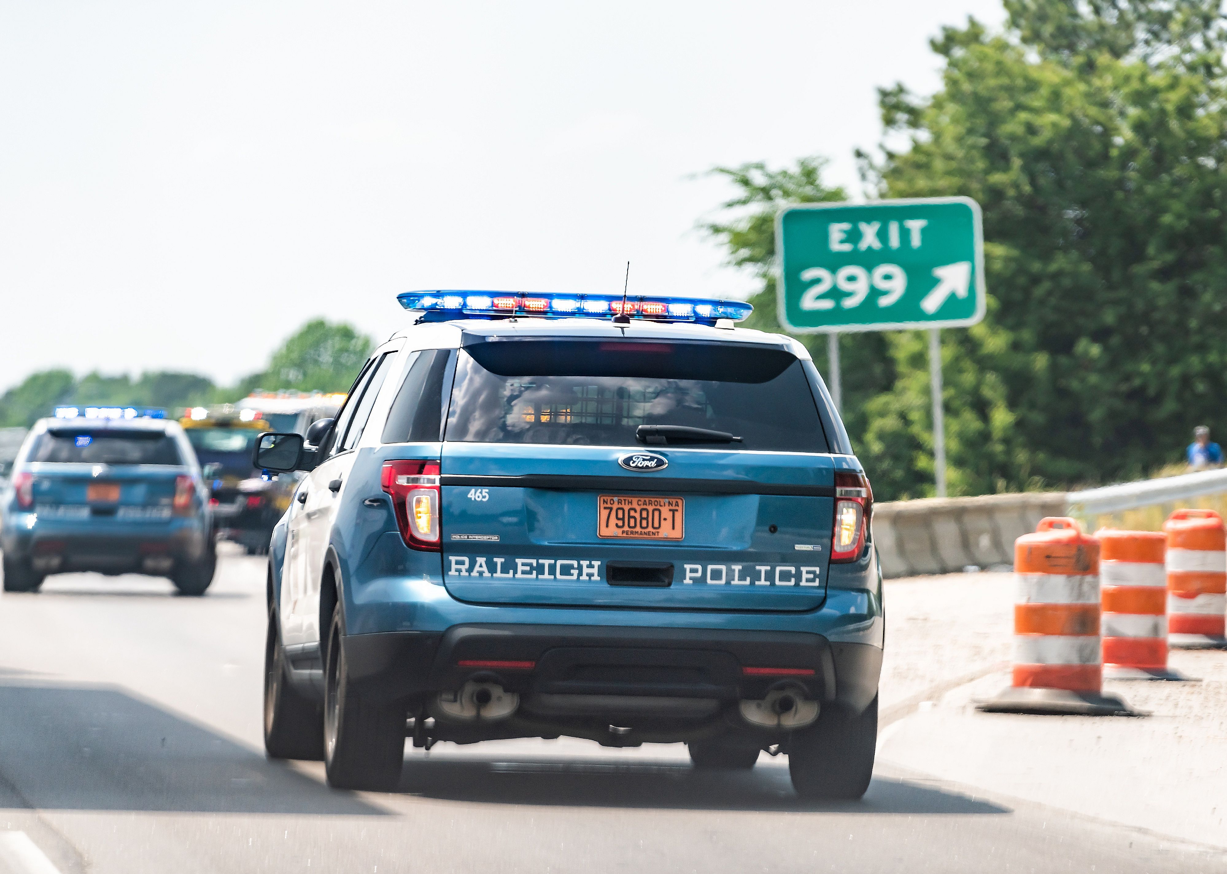 Highway road in North Carolina with closeup of traffic police car.