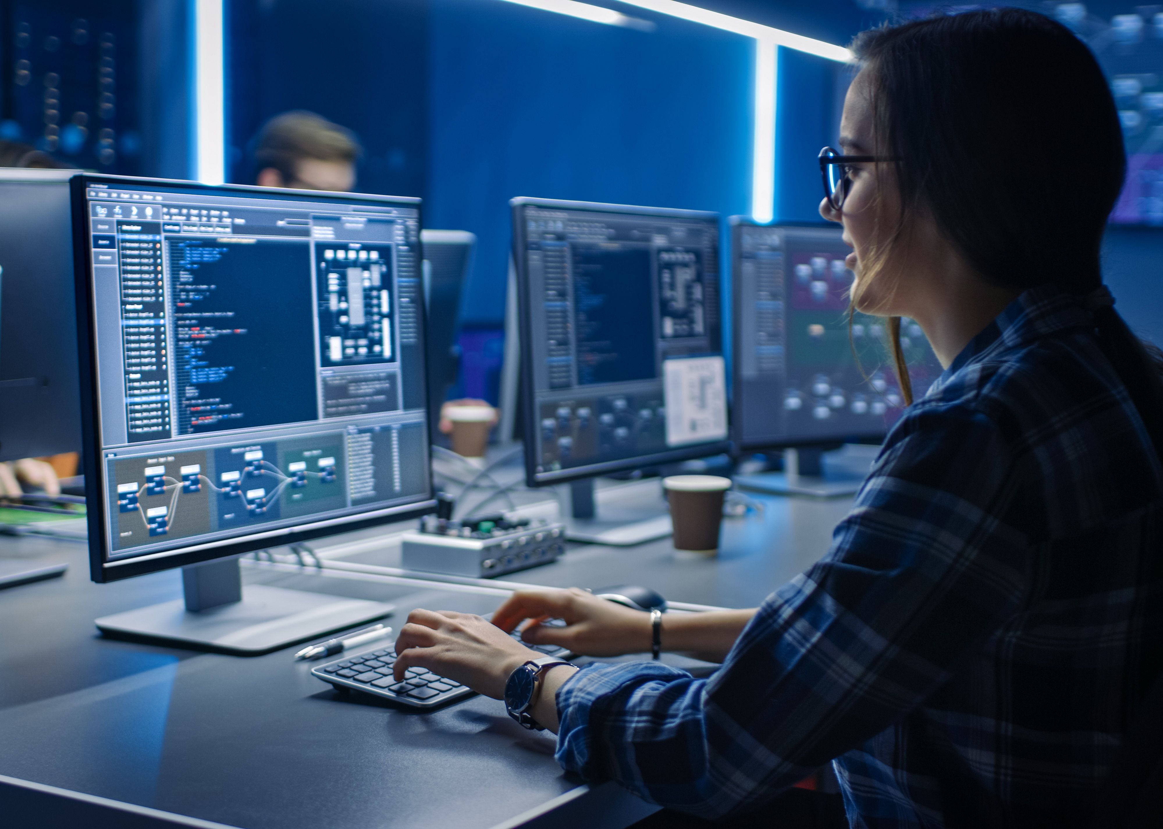 Programmer working on code on a computer.