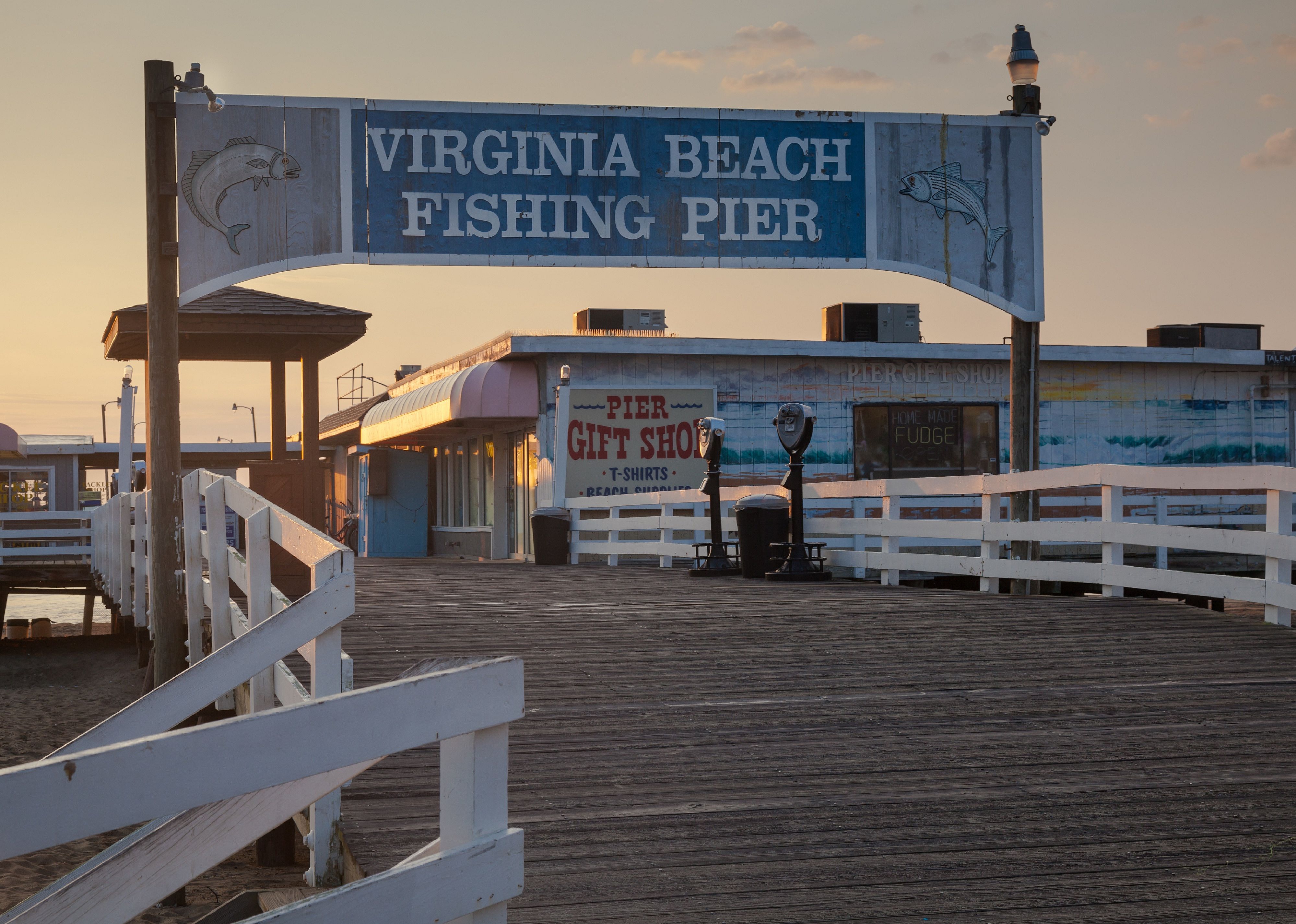 Sunset and fishing pier sign.