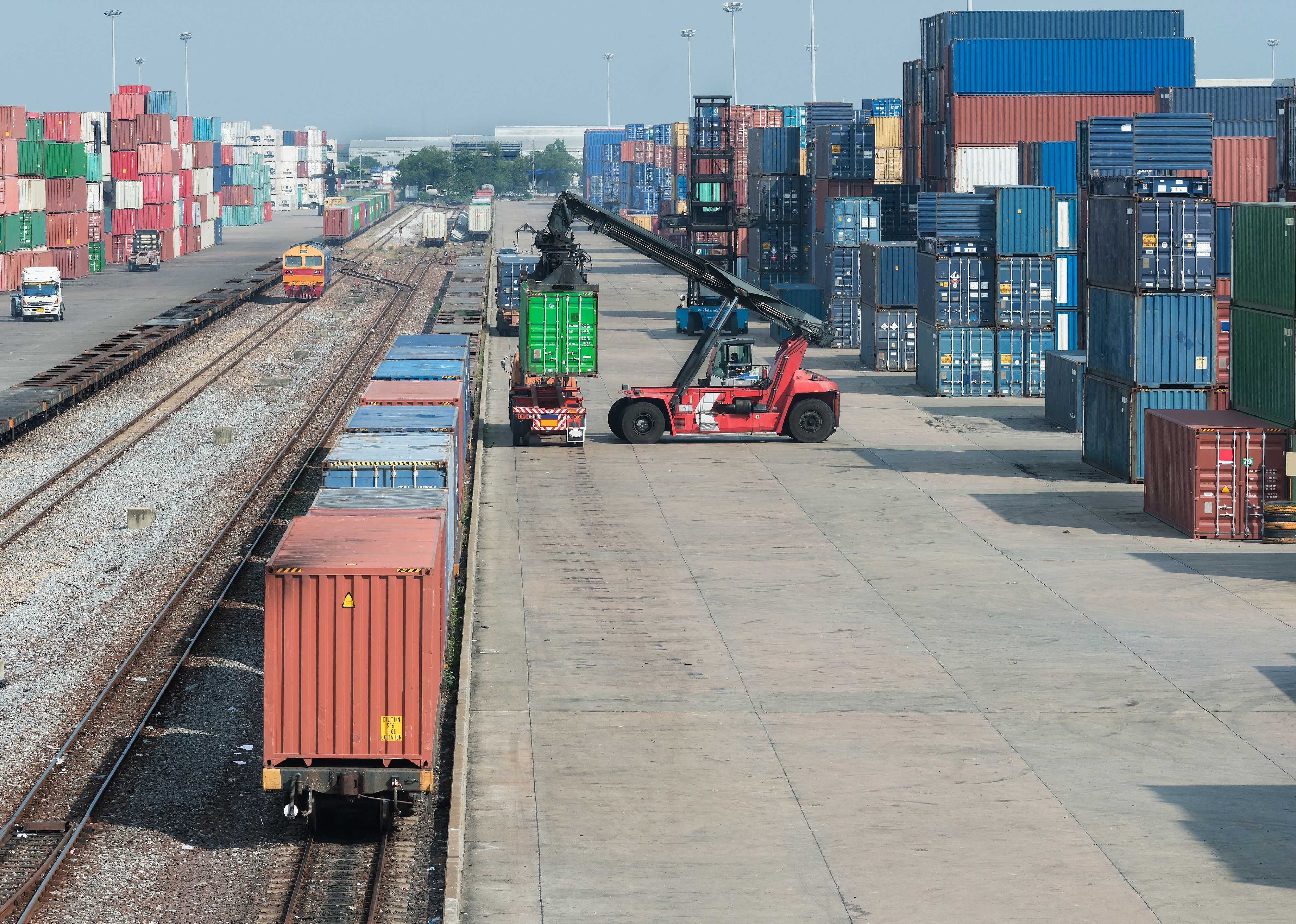 Cargo train platform with freight train container.