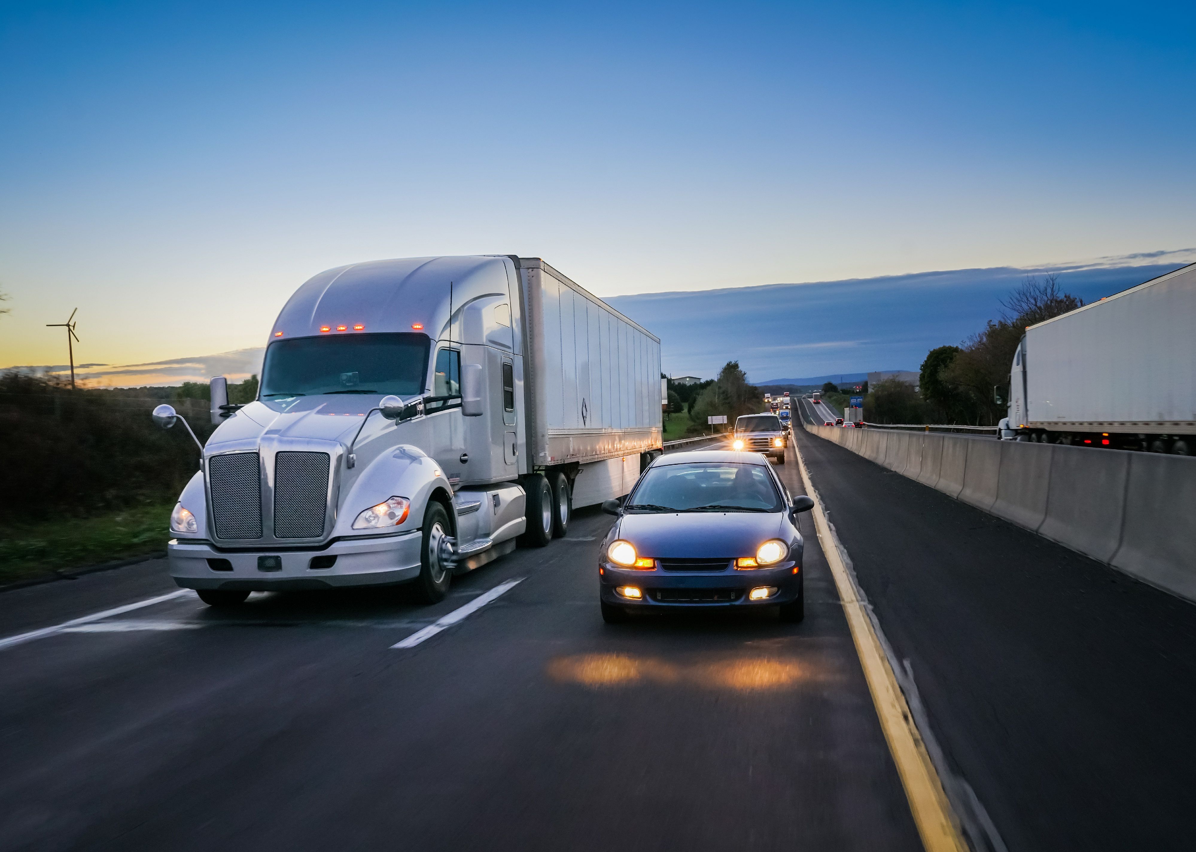 18 wheeler semi truck at night on highway