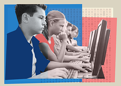 Students working at computers in a classroom.