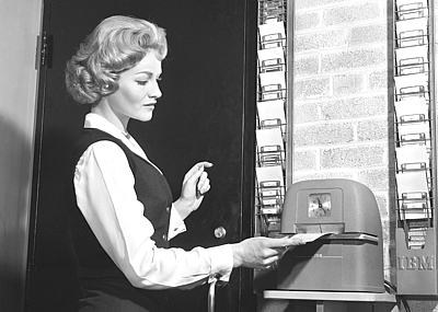 Woman punching time clock