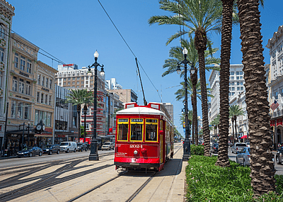 Red streetcar on Canal Street in New Orleans.